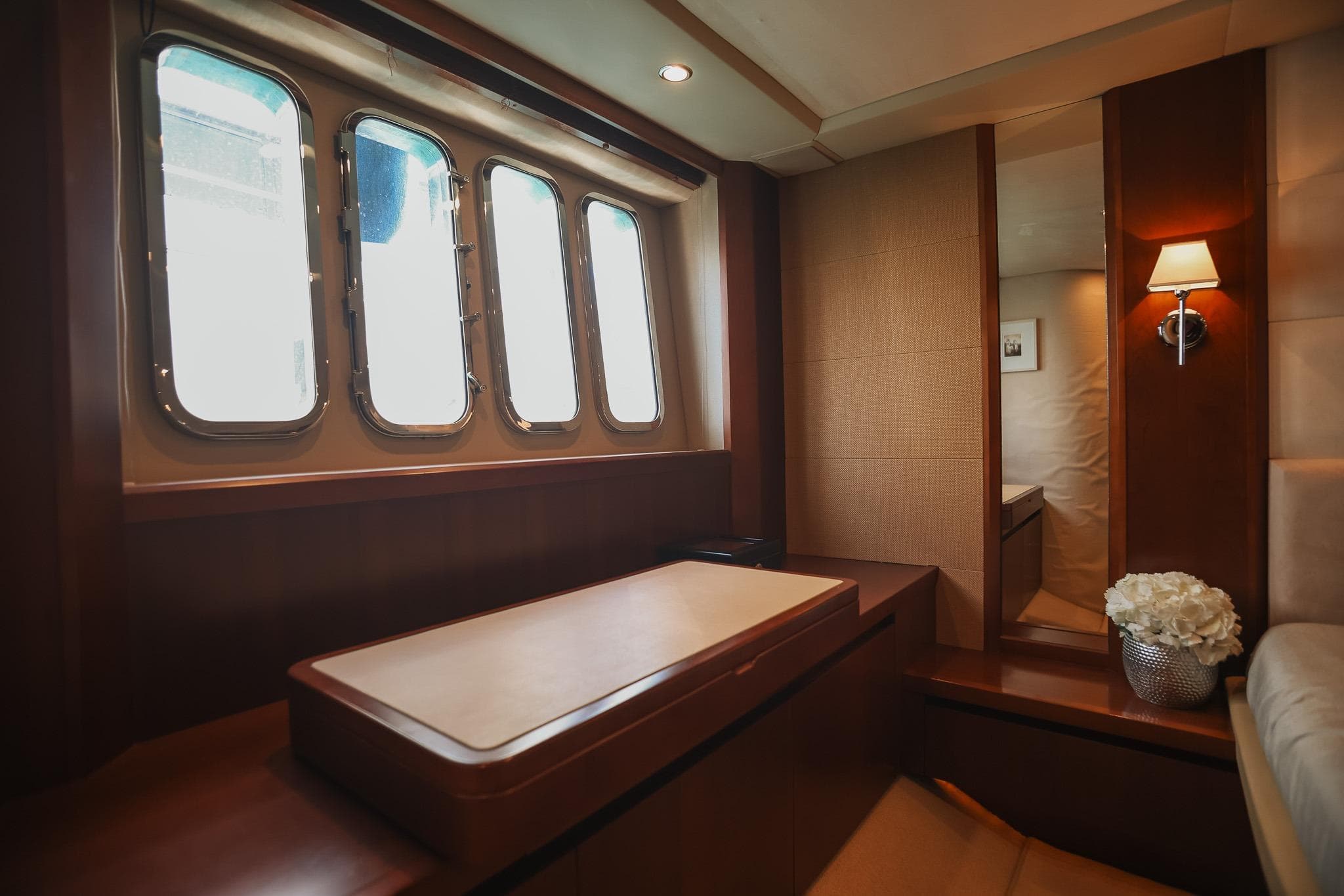 Luxurious interior of 2008 Princess V65 yacht with elegant wood finish and soft lighting.