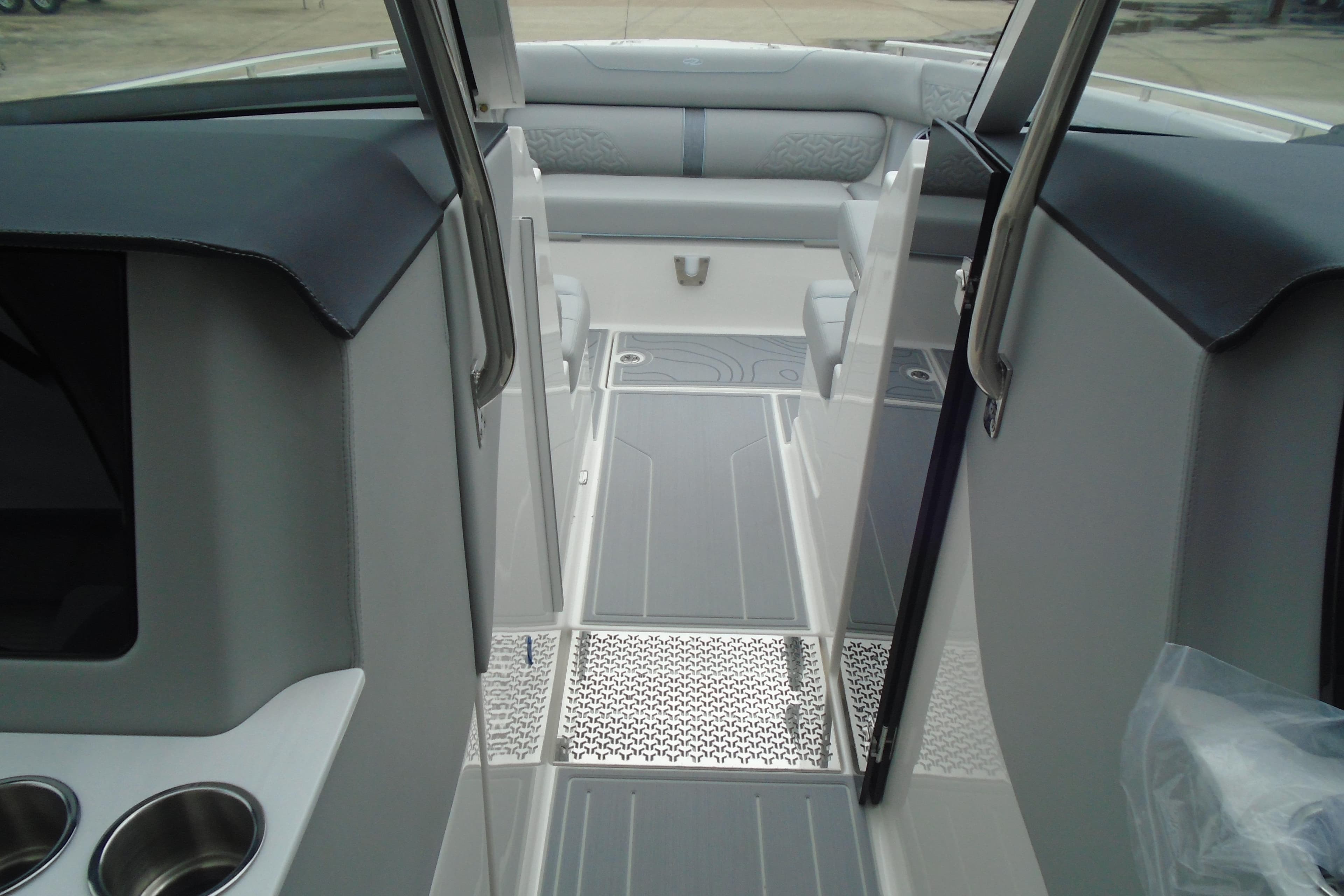 Interior view of 2026 Regal LX36 boat, featuring sleek seating and modern design elements.