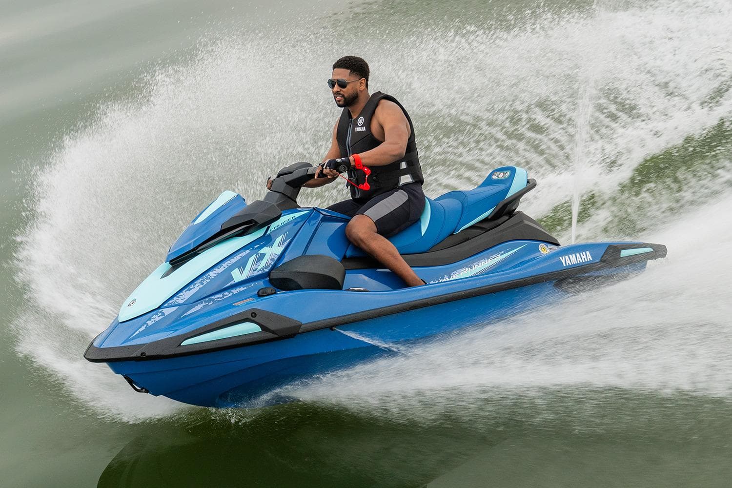 Manufacturer Provided Image: 2026 Yamaha WaveRunner VX Cruiser in action on water, rider wearing life vest.