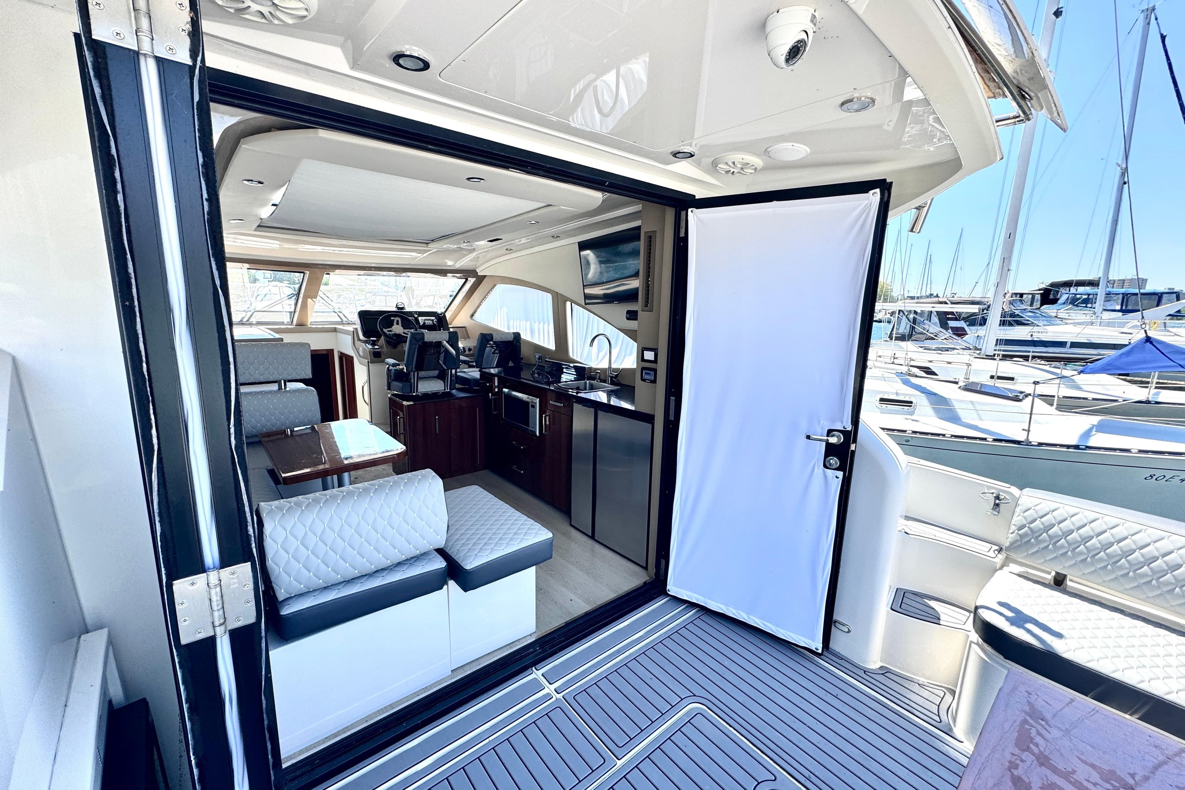 Luxurious interior of a 2015 Carver C37 yacht, featuring modern seating and sleek design.