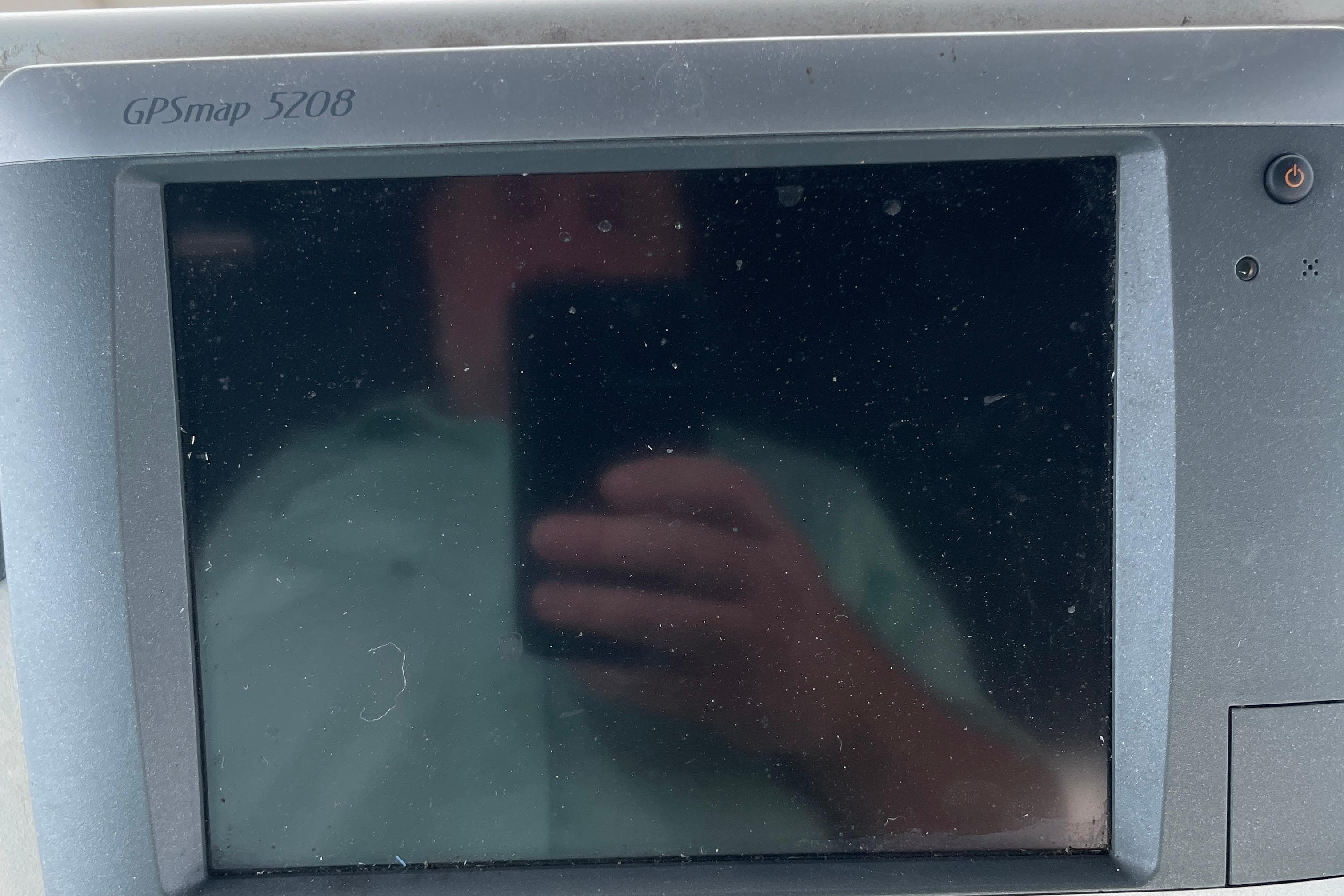 GPSmap 5208 display on 1996 Carver 400 Cockpit Motor Yacht, showing reflection.