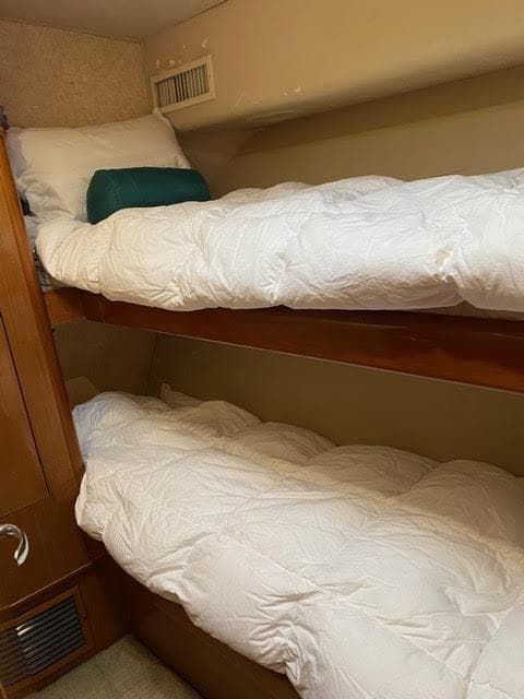 Bunk beds in the 2003 Viking 50 Open yacht cabin.