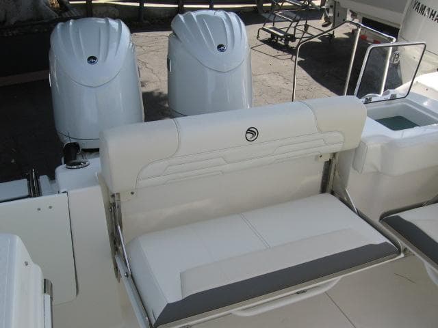 2024 Edgewater 262 CX boat with dual outboard engines and rear seating.