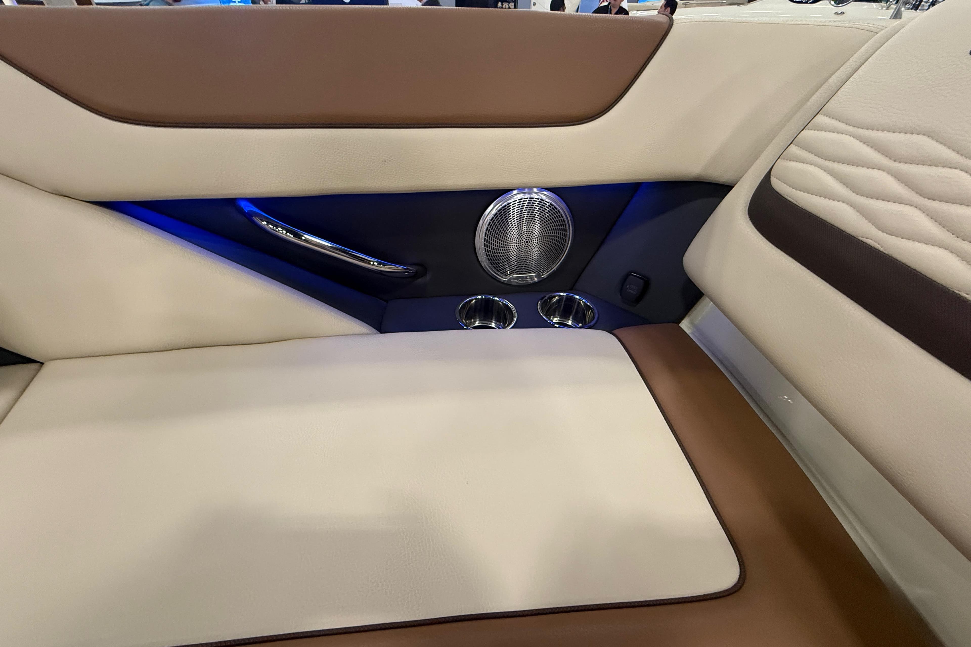 Luxurious interior of 2026 Chris-Craft Launch 27 boat with elegant seating and speaker system.