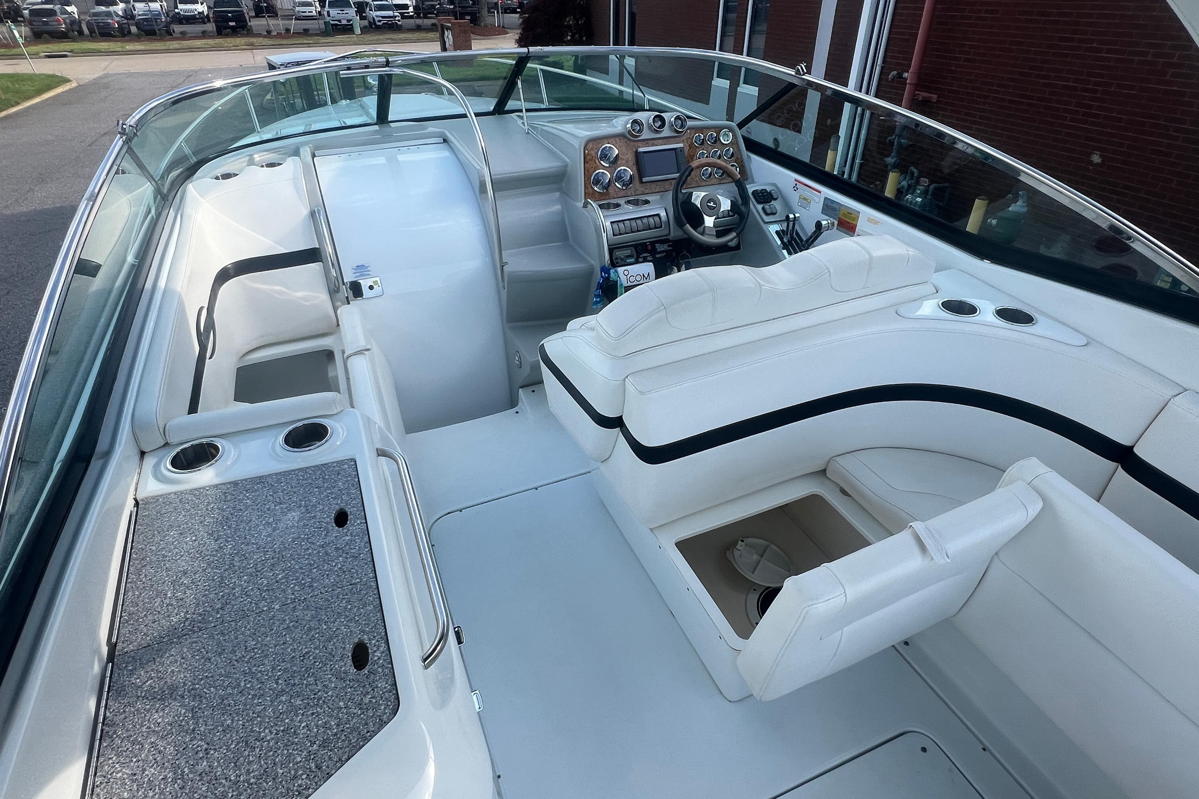 2008 Formula 310 Sun Sport boat interior with white seating and modern dashboard.