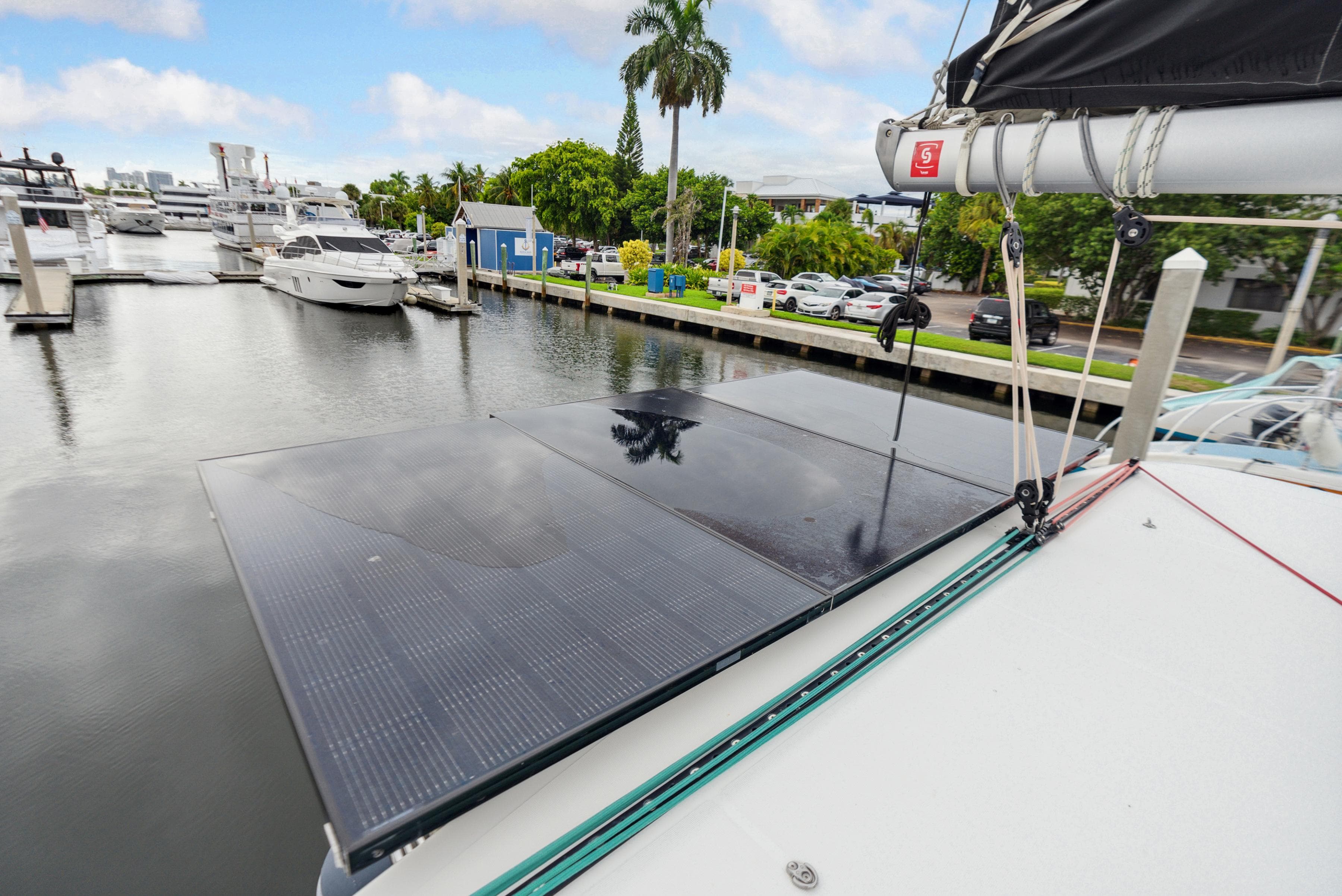 2019 Lagoon 42 catamaran with solar panel in marina.