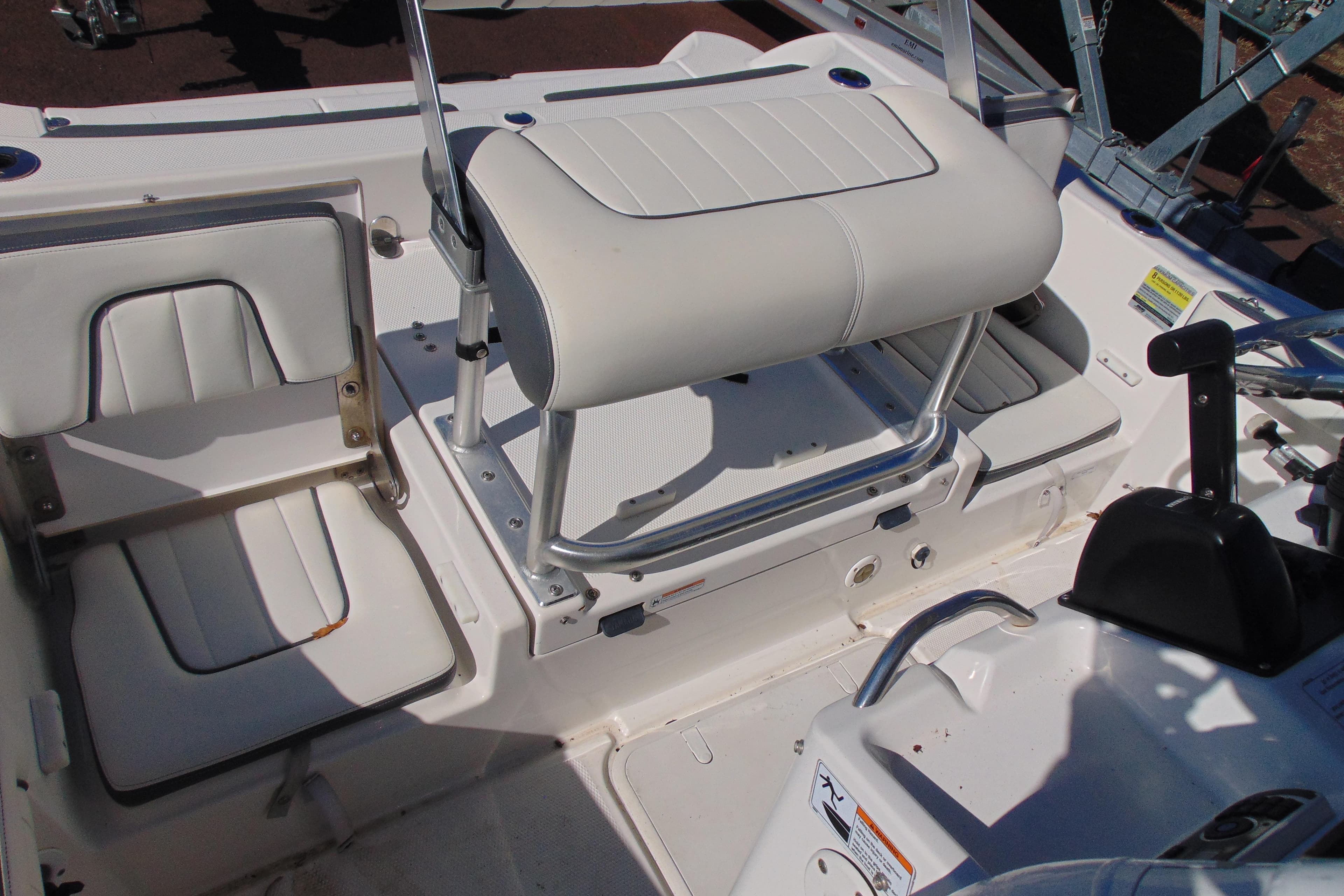 2016 Yamaha Boats 190 FSH Sport interior with white seating and control panel.
