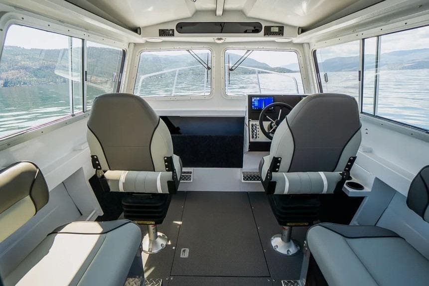 Interior of 2026 KingFisher 2325 Coastal Express boat with modern seating and controls.