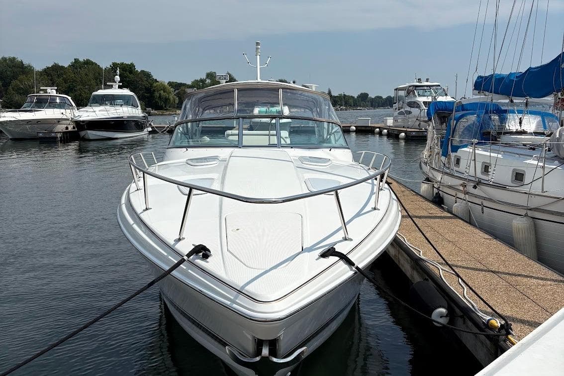 2001 Formula 400ss boat docked in a marina, surrounded by other vessels.