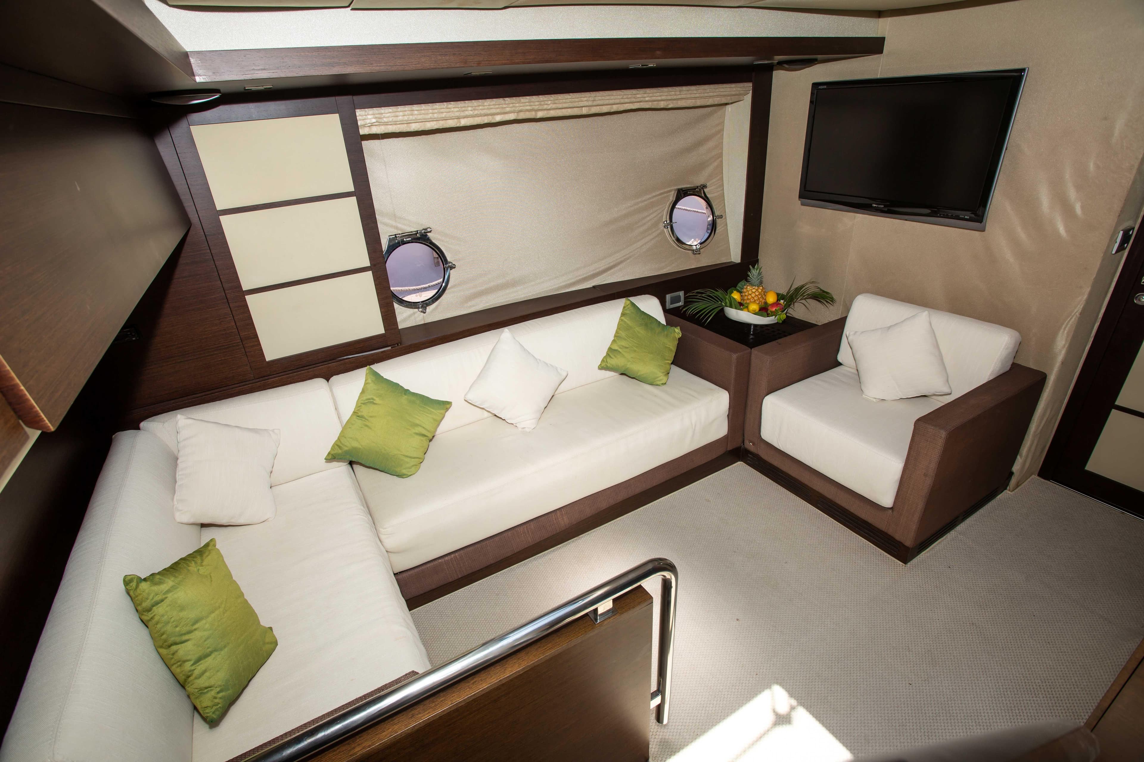 Luxurious interior of 2008 Azimut 62S yacht with elegant seating and modern decor.