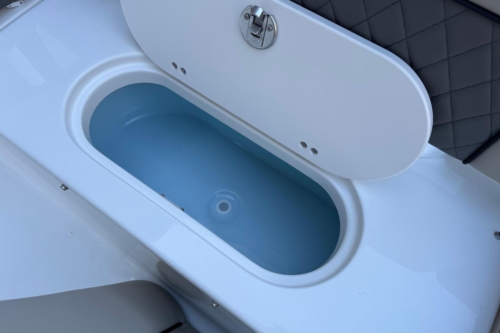 Livewell compartment on 2026 Key West 189 FS boat, featuring a secure latch.