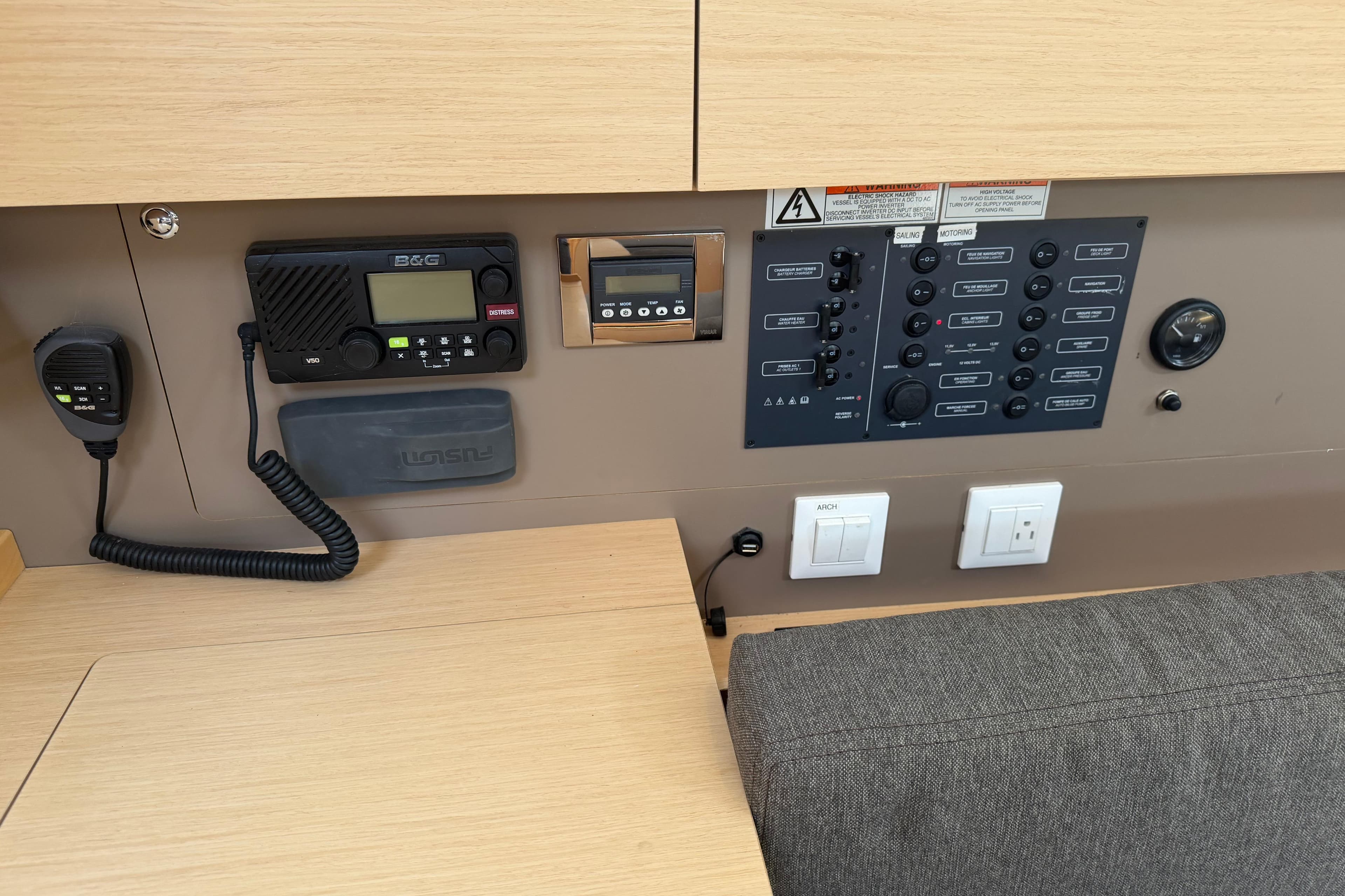 Control panel of a 2017 Beneteau Oceanis 38 sailboat with radio and switches.