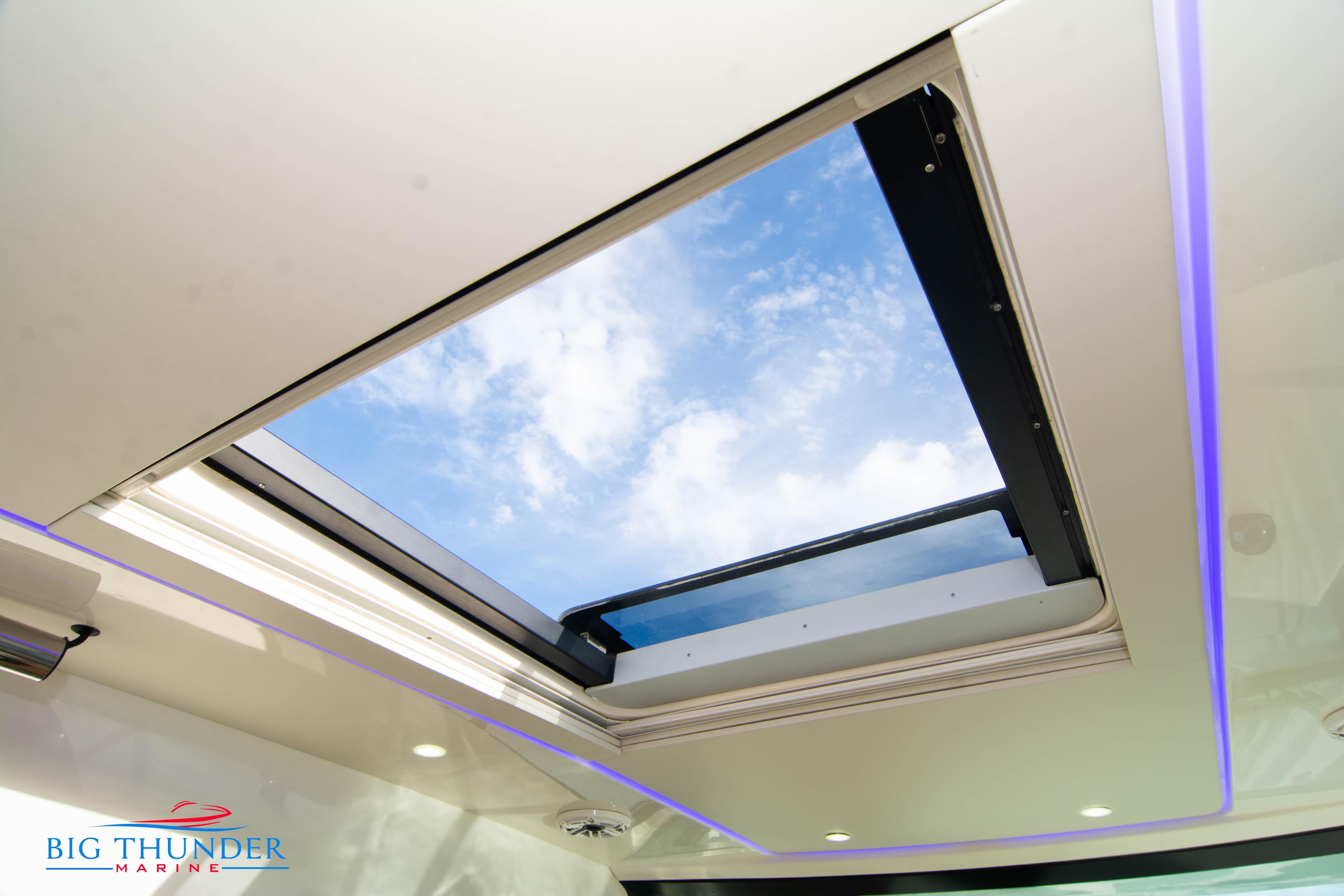 2022 Scout 350 LXZ boat skylight with blue sky view.