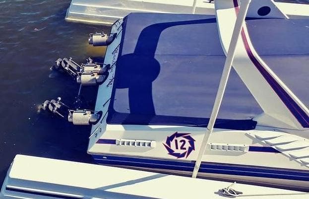 1988 Fountain 12 Meter boat docked, featuring sleek design and powerful engines.