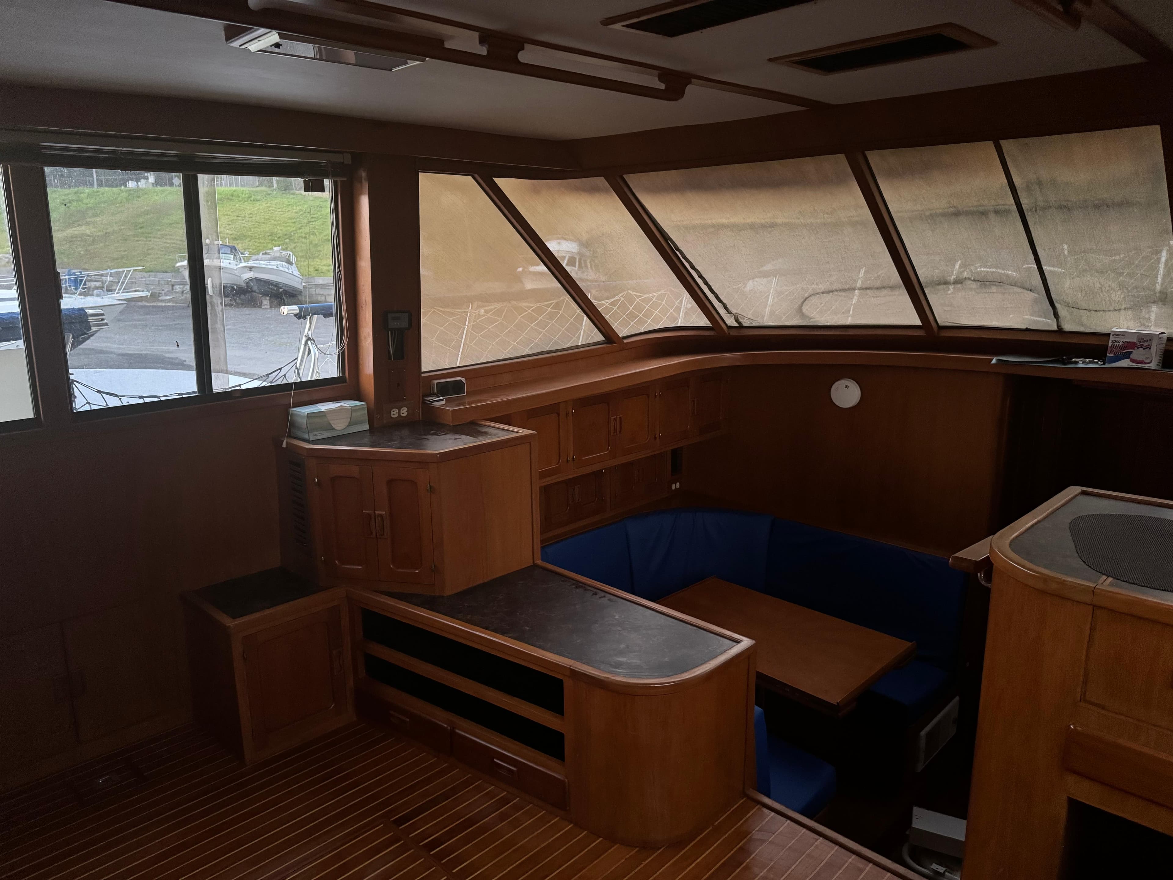 Interior of 1988 Vista 43 Motor Yacht with wood paneling and seating area.