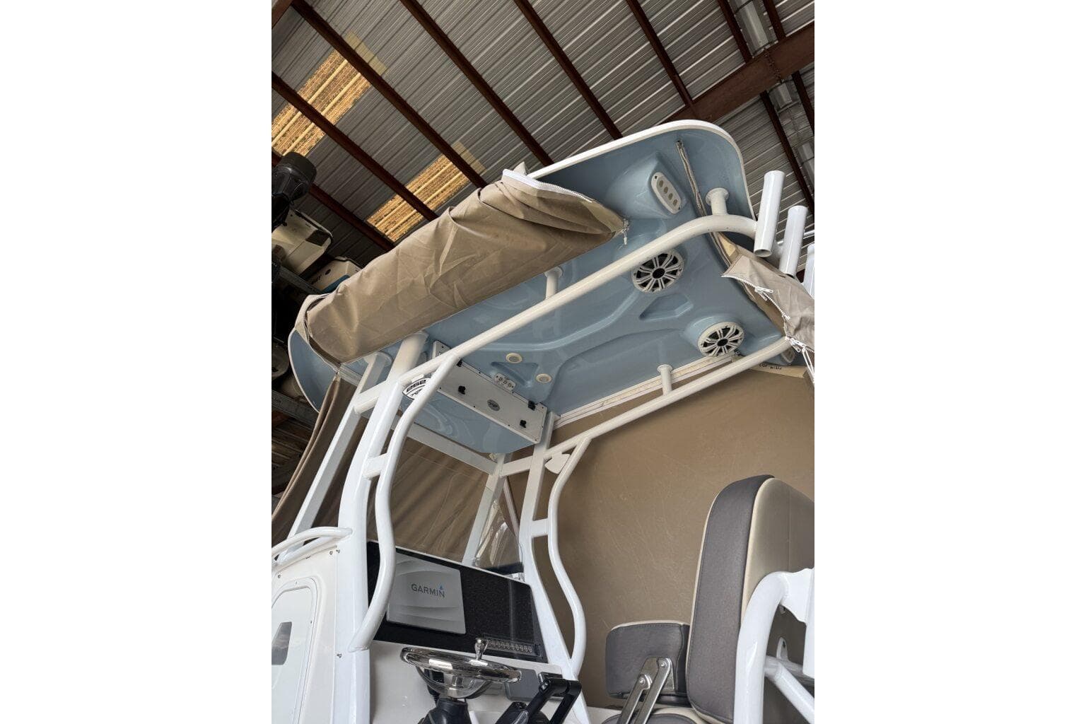 2018 Tidewater 252 CC Adventure boat interior with speakers and canopy.