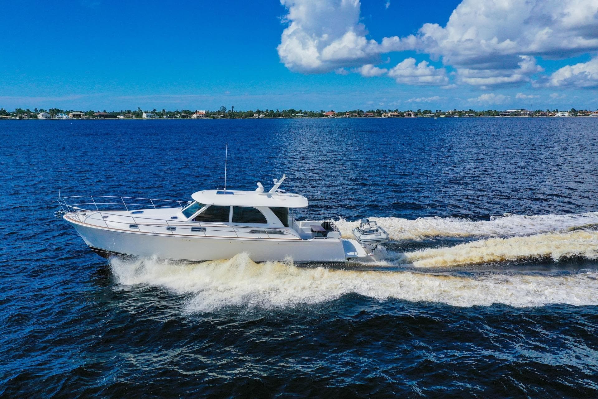 2019 Sabre 45 Salon Express cruising on open water under a clear blue sky.