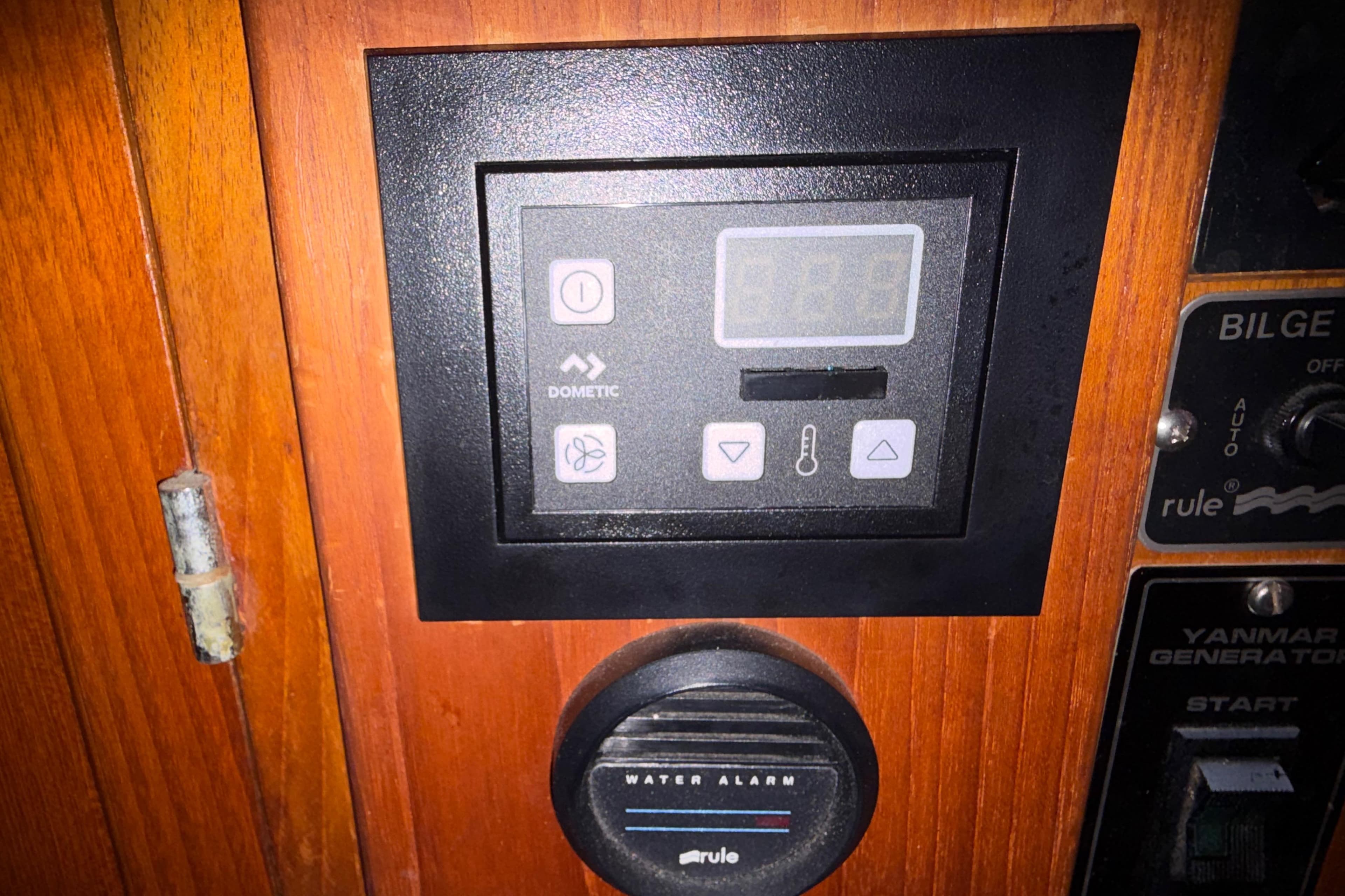 Control panel on 1985 Albin 36 Trawler with Dometic display and water alarm.