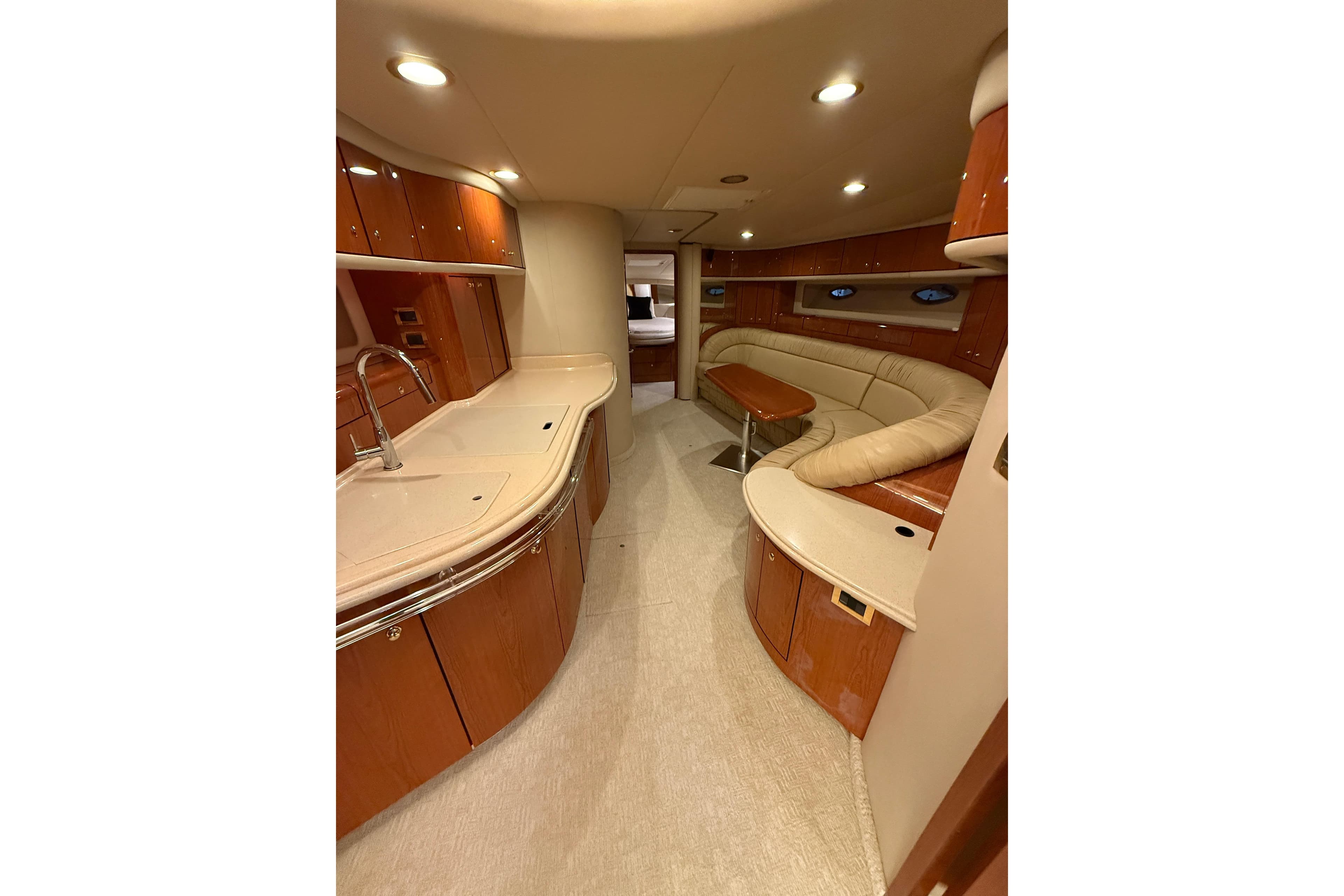 Luxurious interior of 2000 Sea Ray Sundancer 540 yacht with elegant wood finishes.