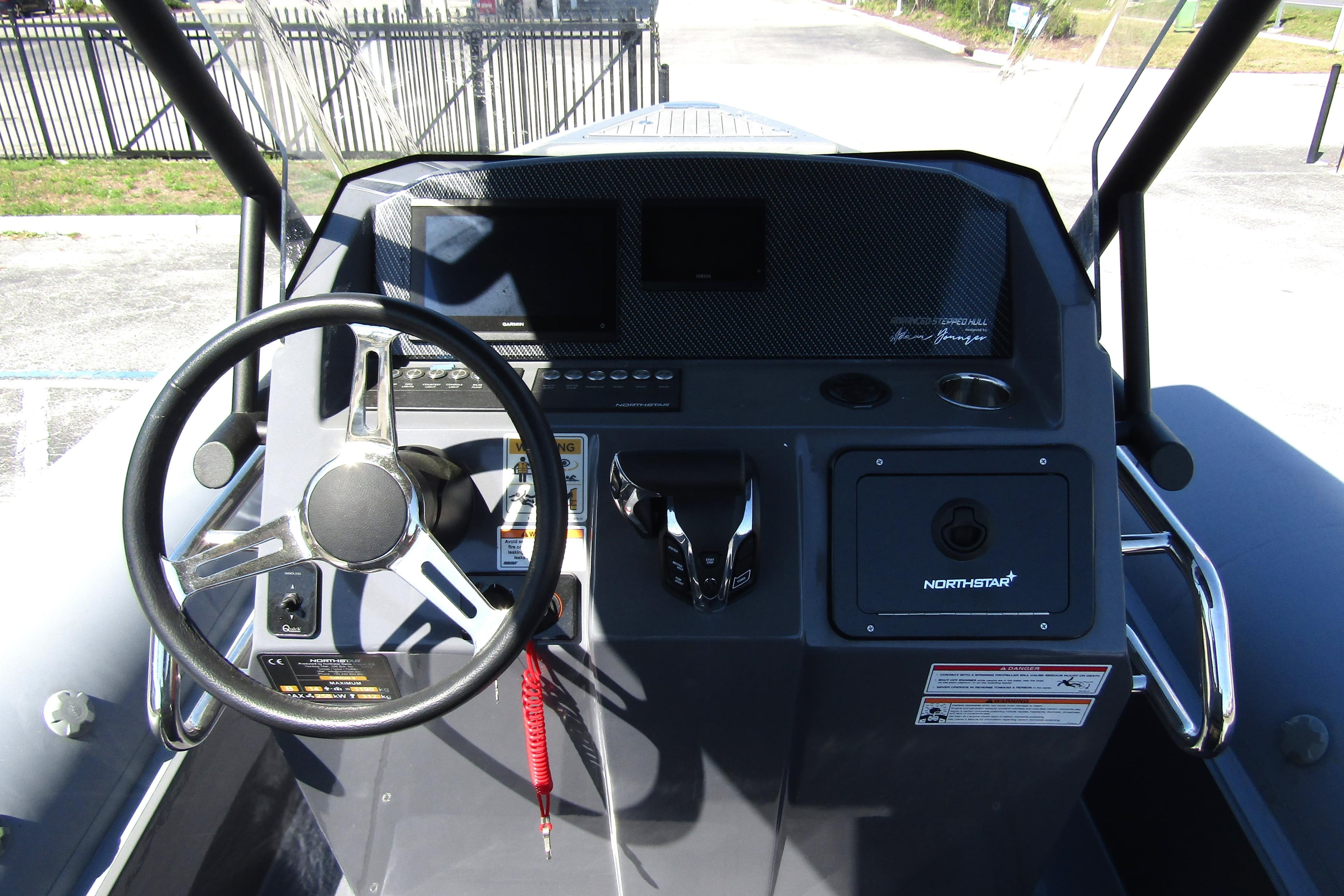 2024 Northstar Orion 8 boat dashboard with steering wheel and control panel.