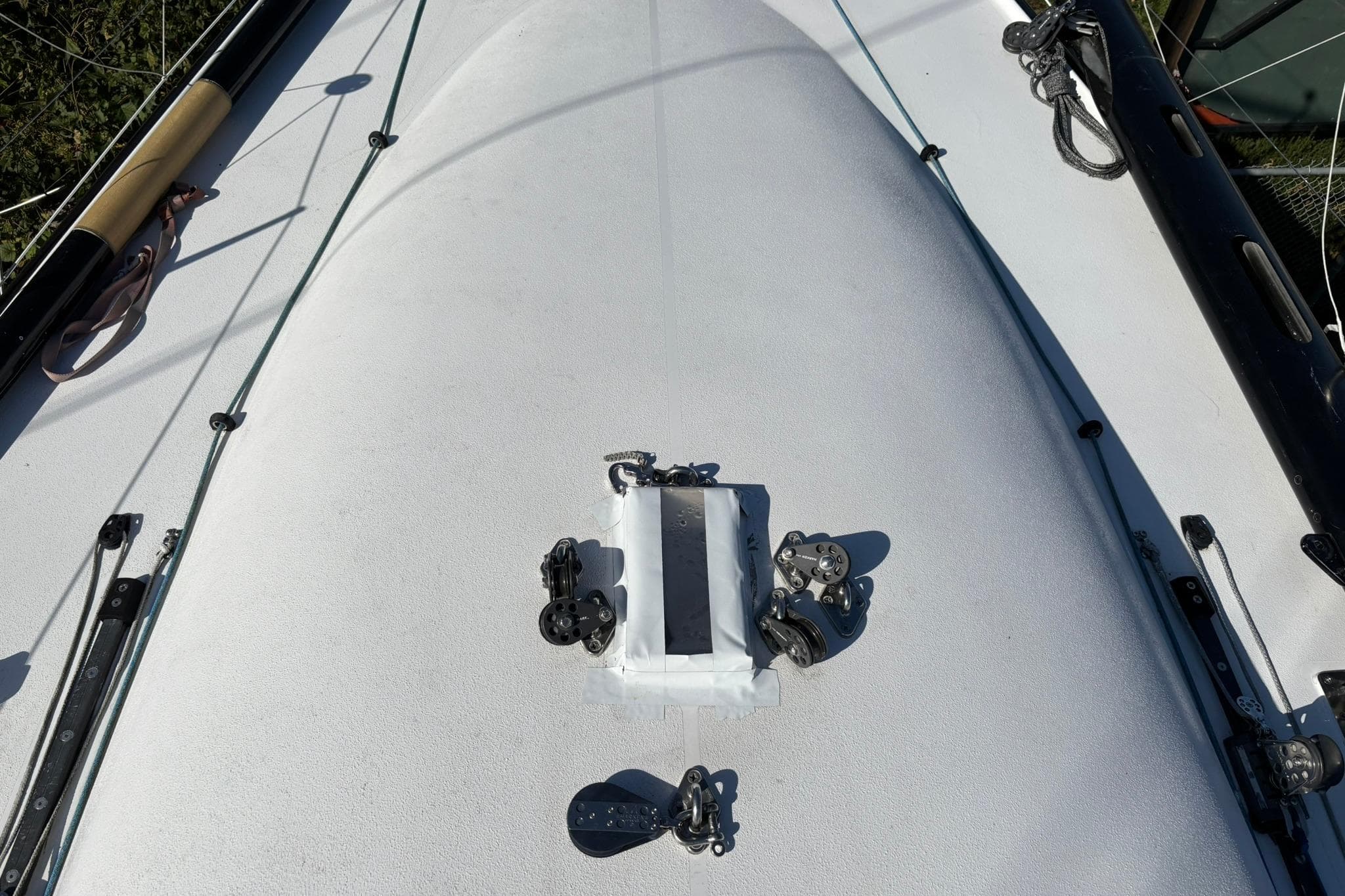 Deck of 1993 Nelson Marek 43 sailboat with rigging and fittings visible.