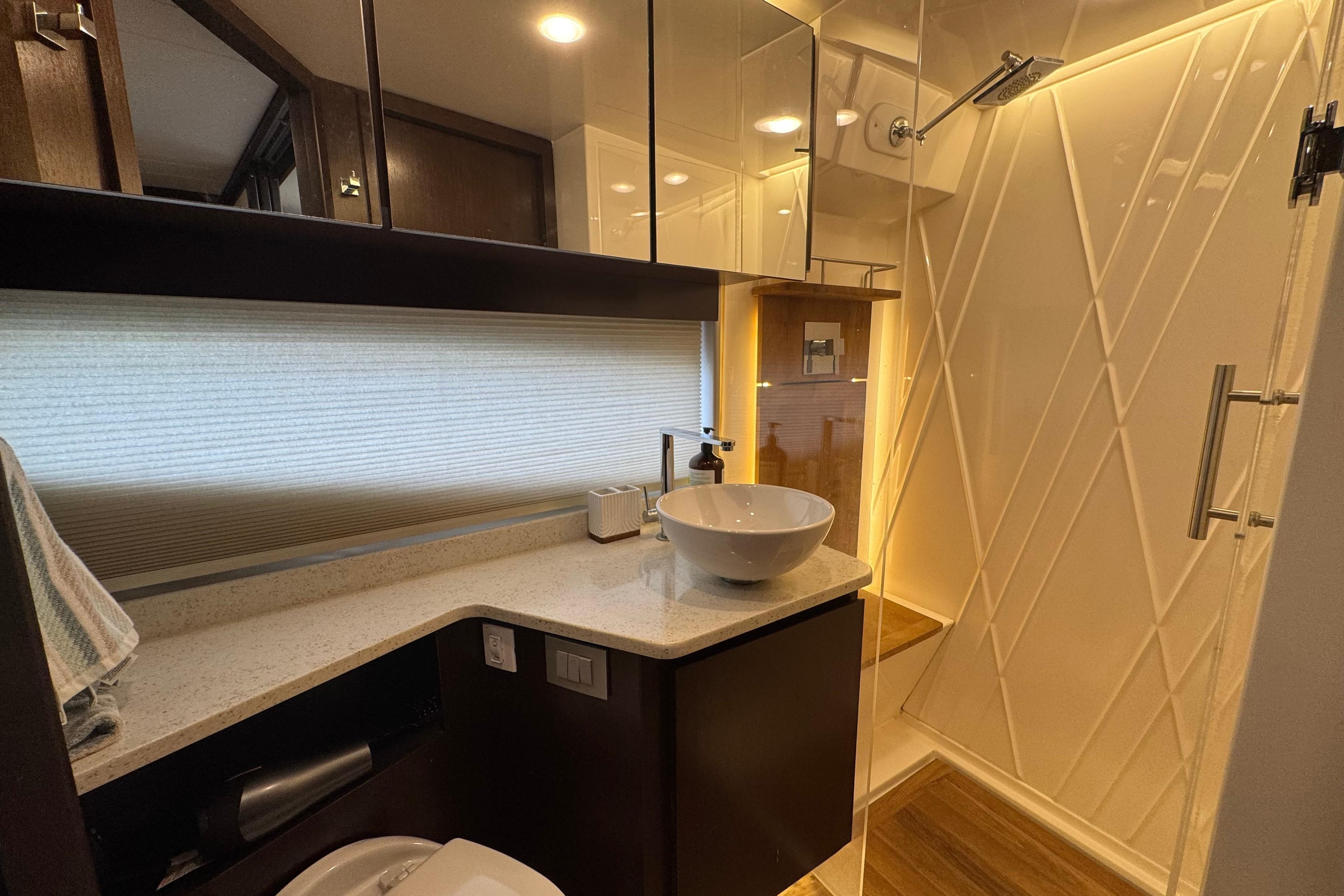 Luxurious bathroom in 2017 Regal 42 Fly yacht with modern fixtures and elegant design.