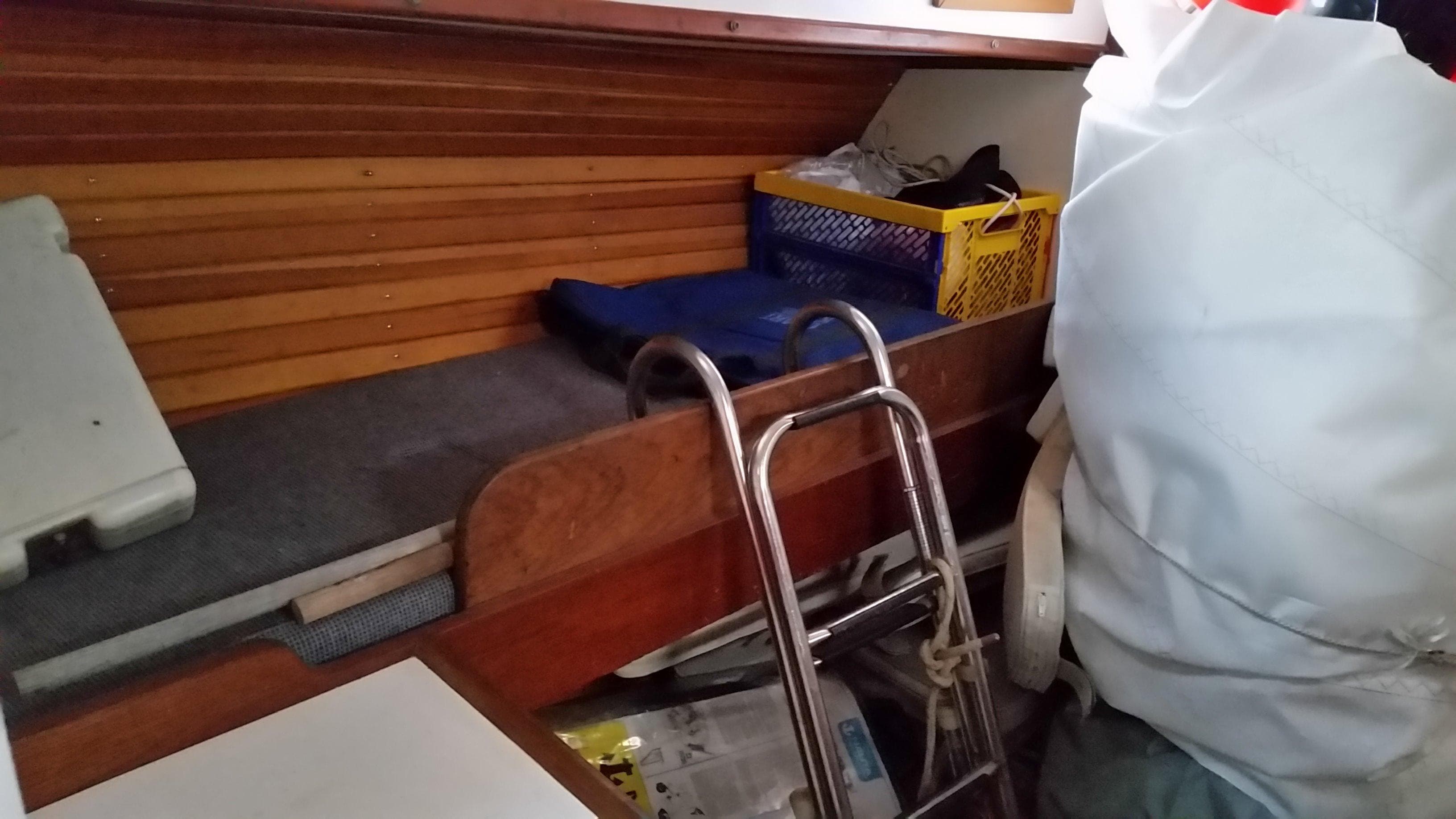 Interior of a 1960 Frans Maas-LeFevre One Off Custom 47 sailboat, featuring storage and ladder.