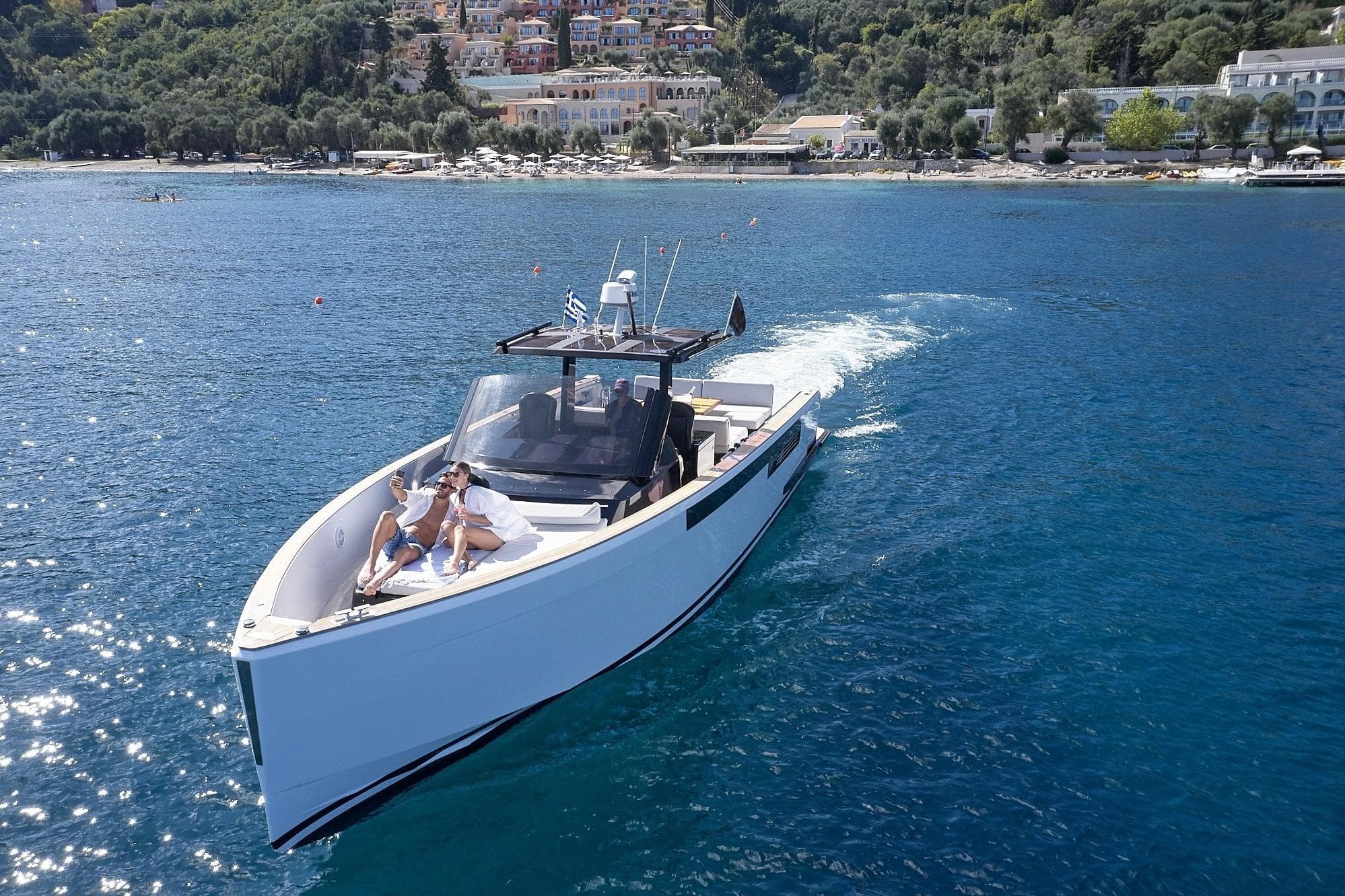 Fjord 40 Open yacht cruising near scenic coastline, 2007 model.