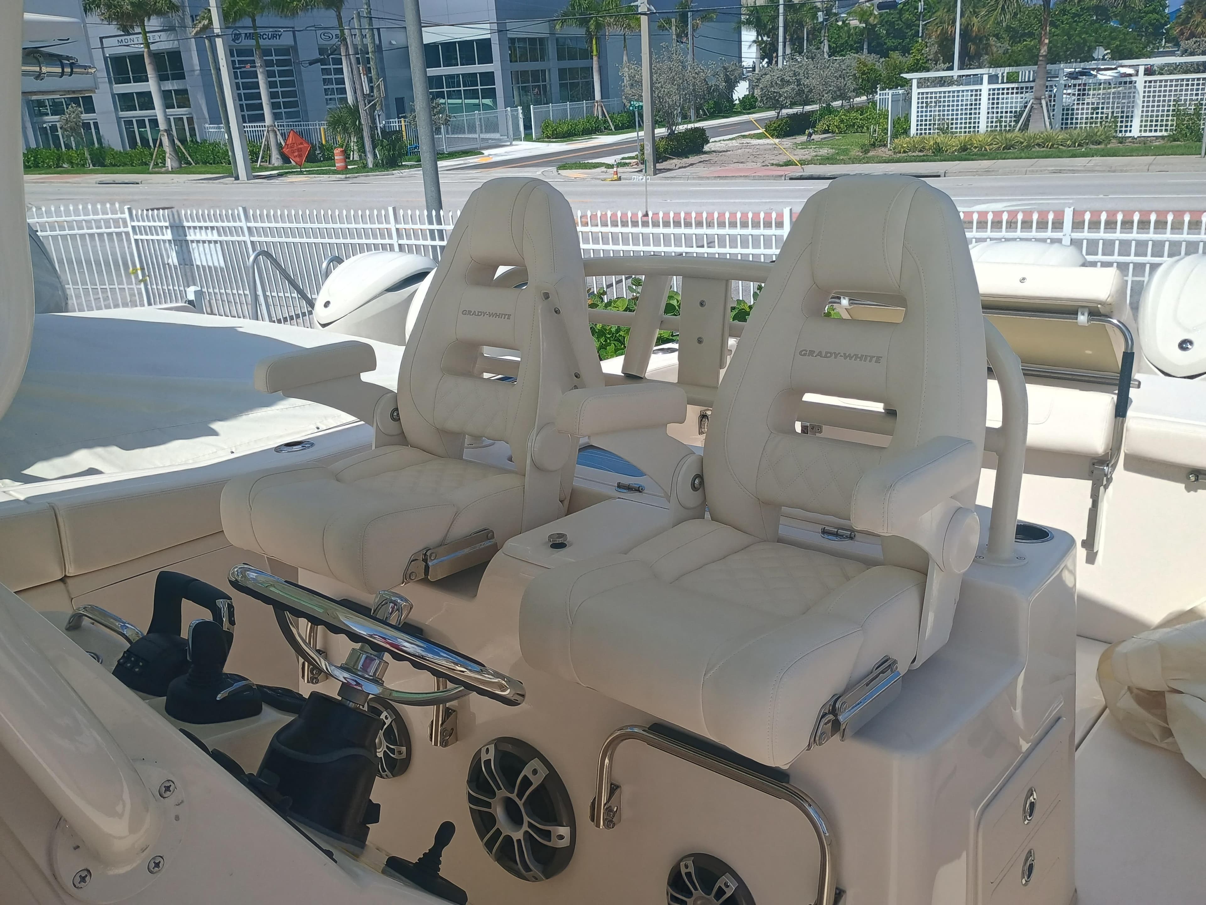 2025 Grady-White Canyon 306 boat interior with dual captain's chairs and steering wheel.
