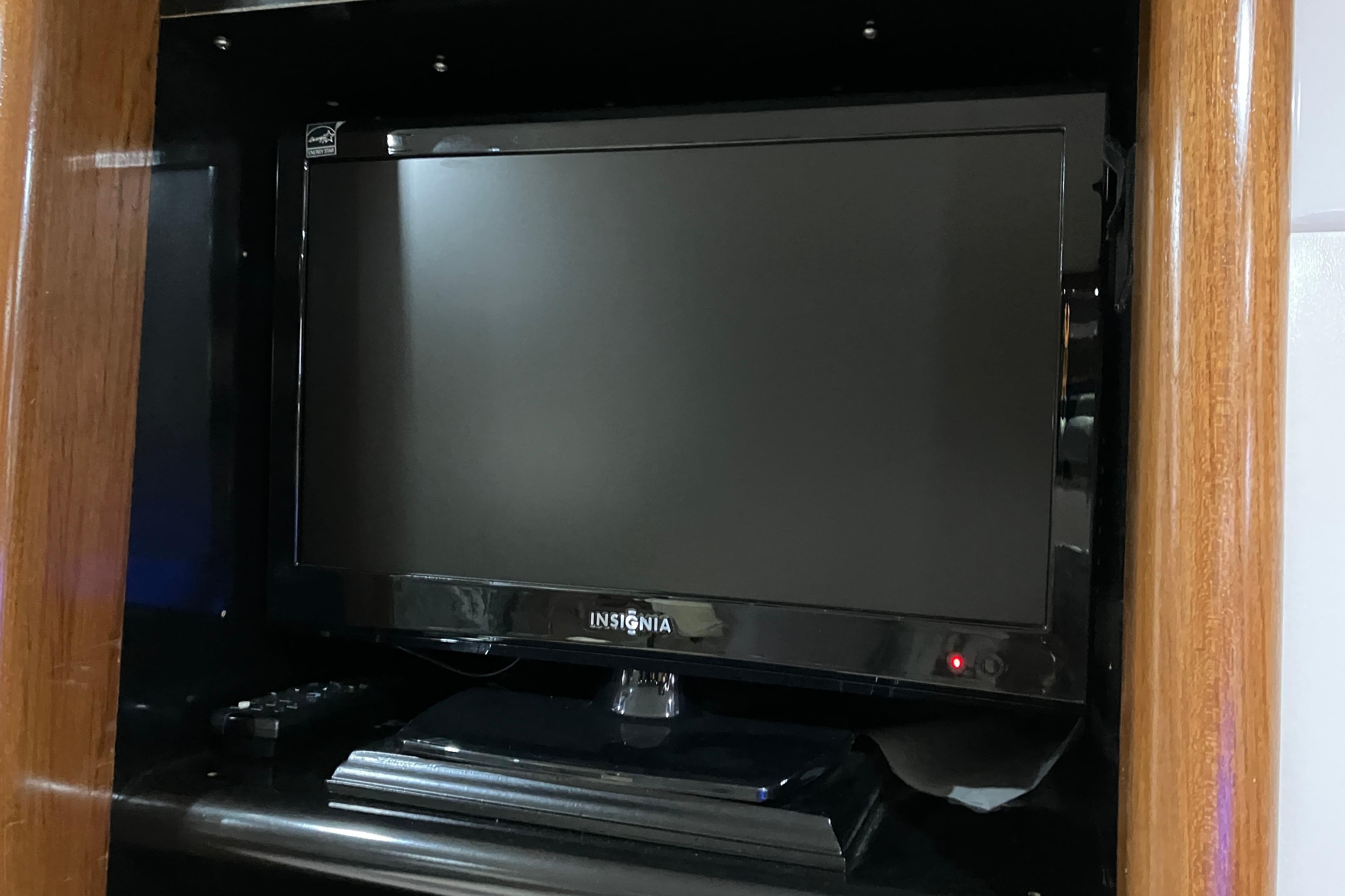 Insignia TV inside 1995 Viking 50 Motor Yacht, wooden cabinet setting.