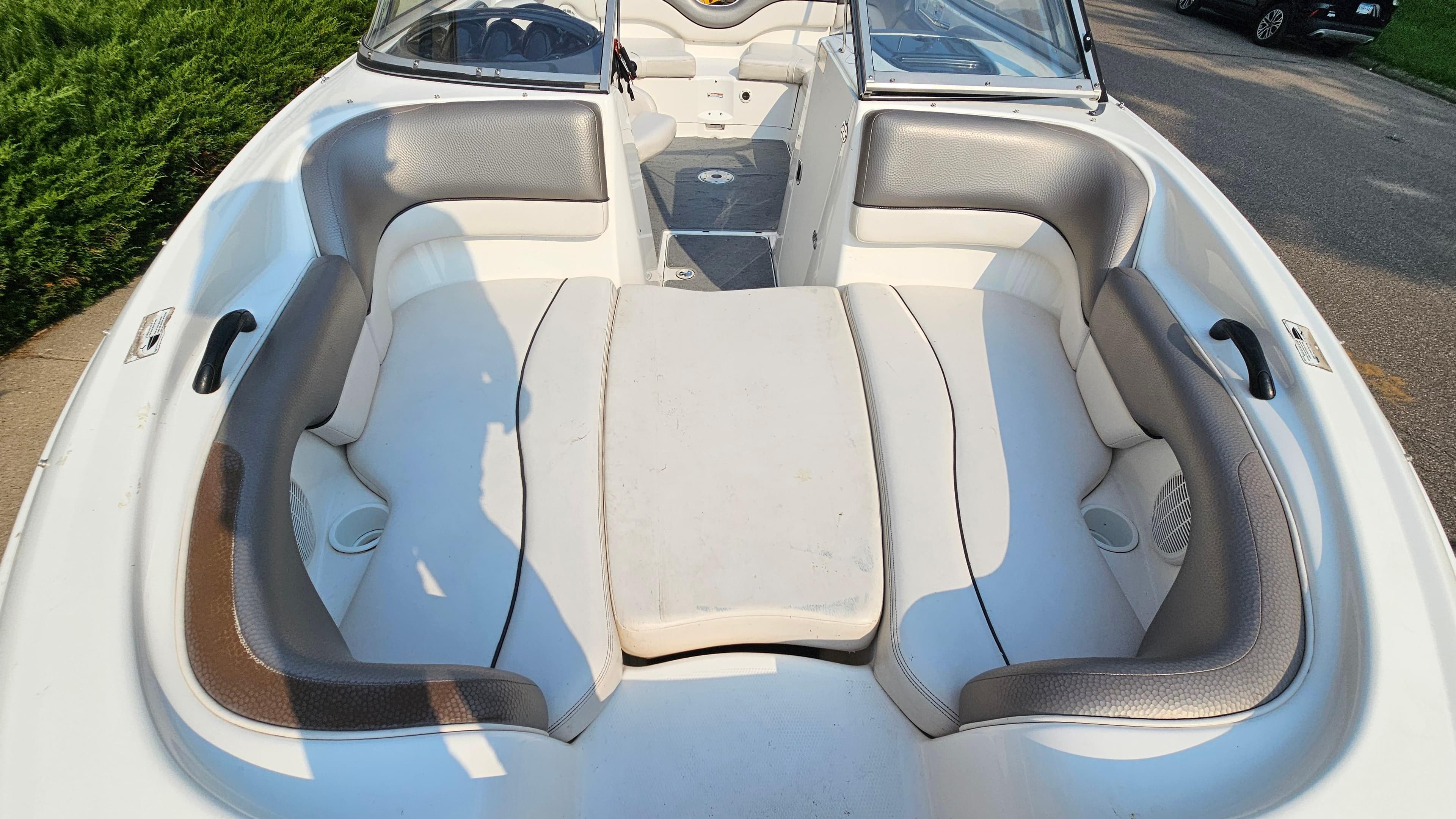 2011 Yamaha Boats SX210 interior with cushioned seating and steering console.