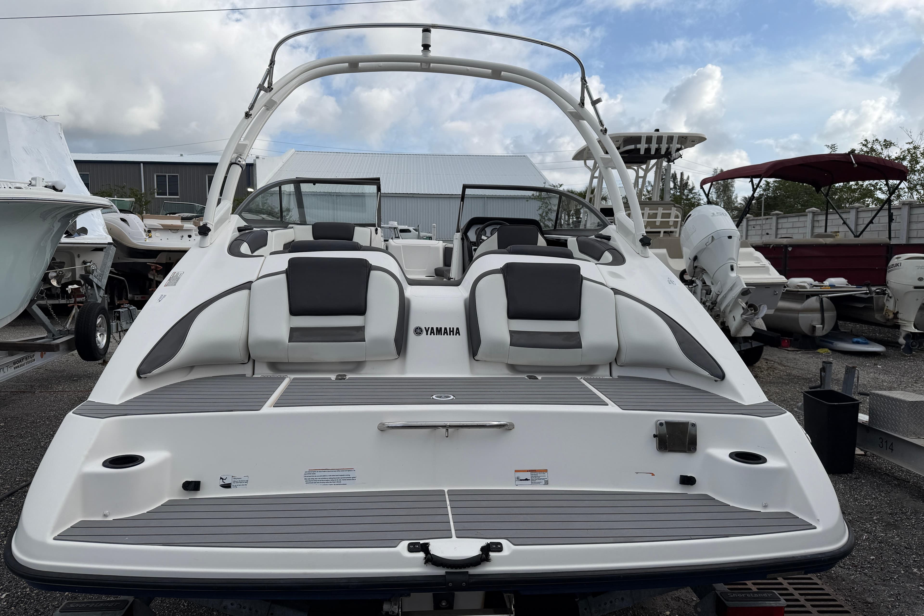 2022 Yamaha Boats AR210, sleek design, rear view, docked, ready for adventure.