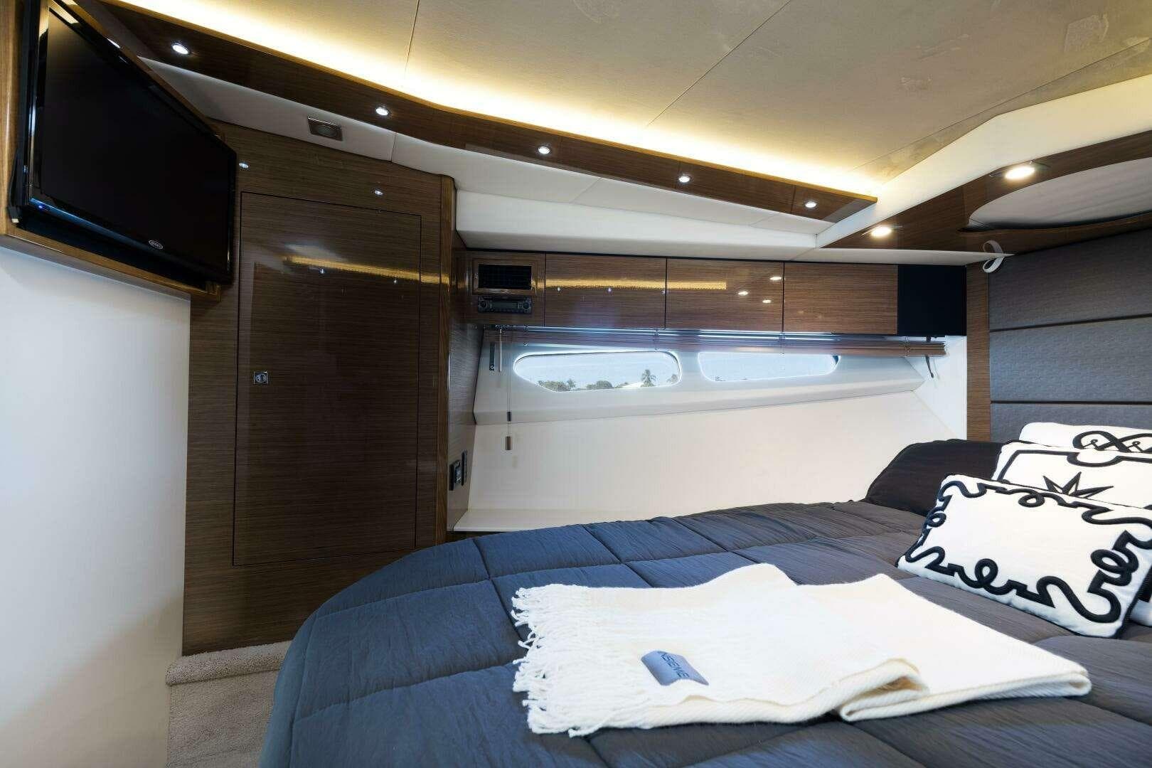 Luxurious interior of 2018 Cruisers Cantius 45 yacht with modern bedroom design.