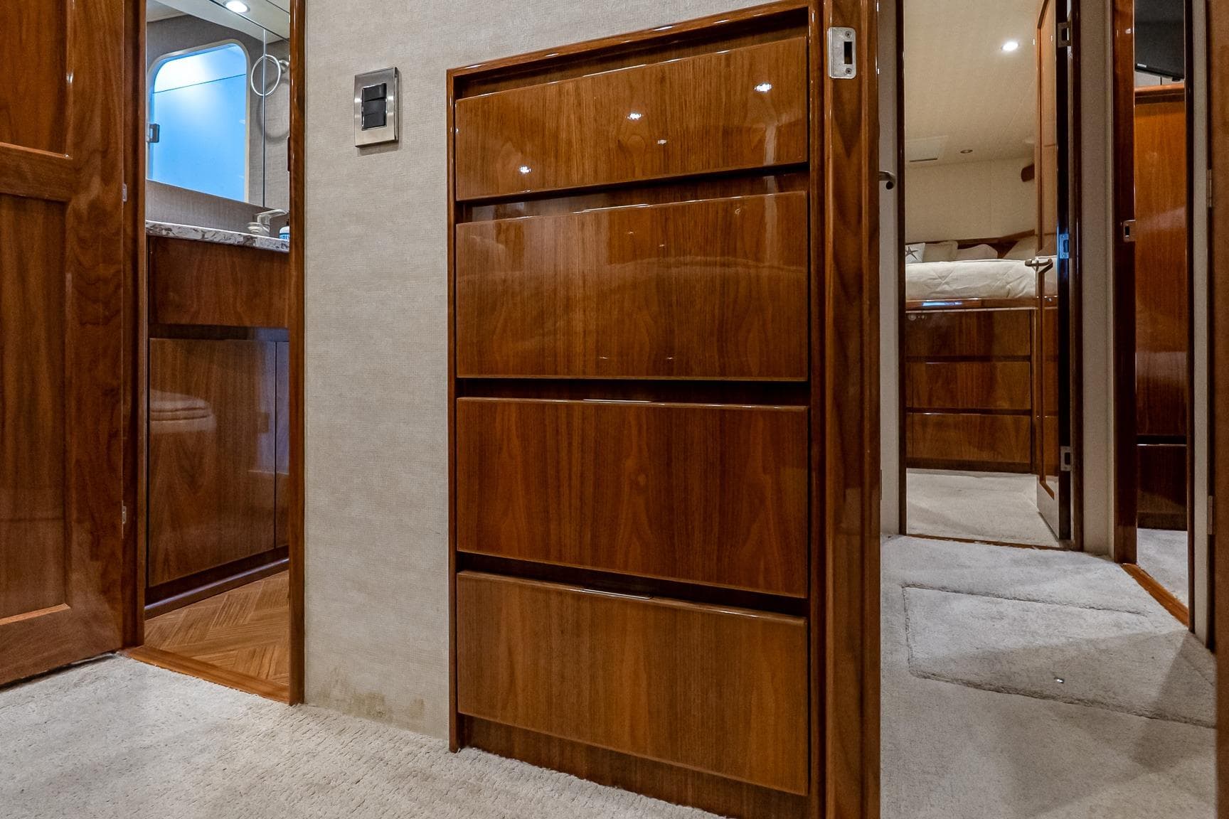 Luxurious interior of 2017 Viking 62 Enclosed Bridge yacht with polished wood cabinetry.