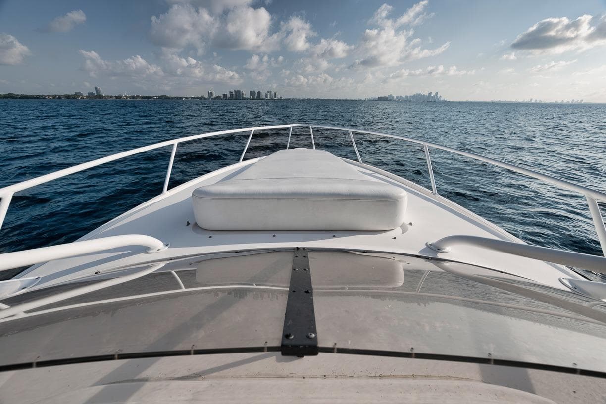 Bow view of 2018 Intrepid 390 Sport Yacht cruising on open water.