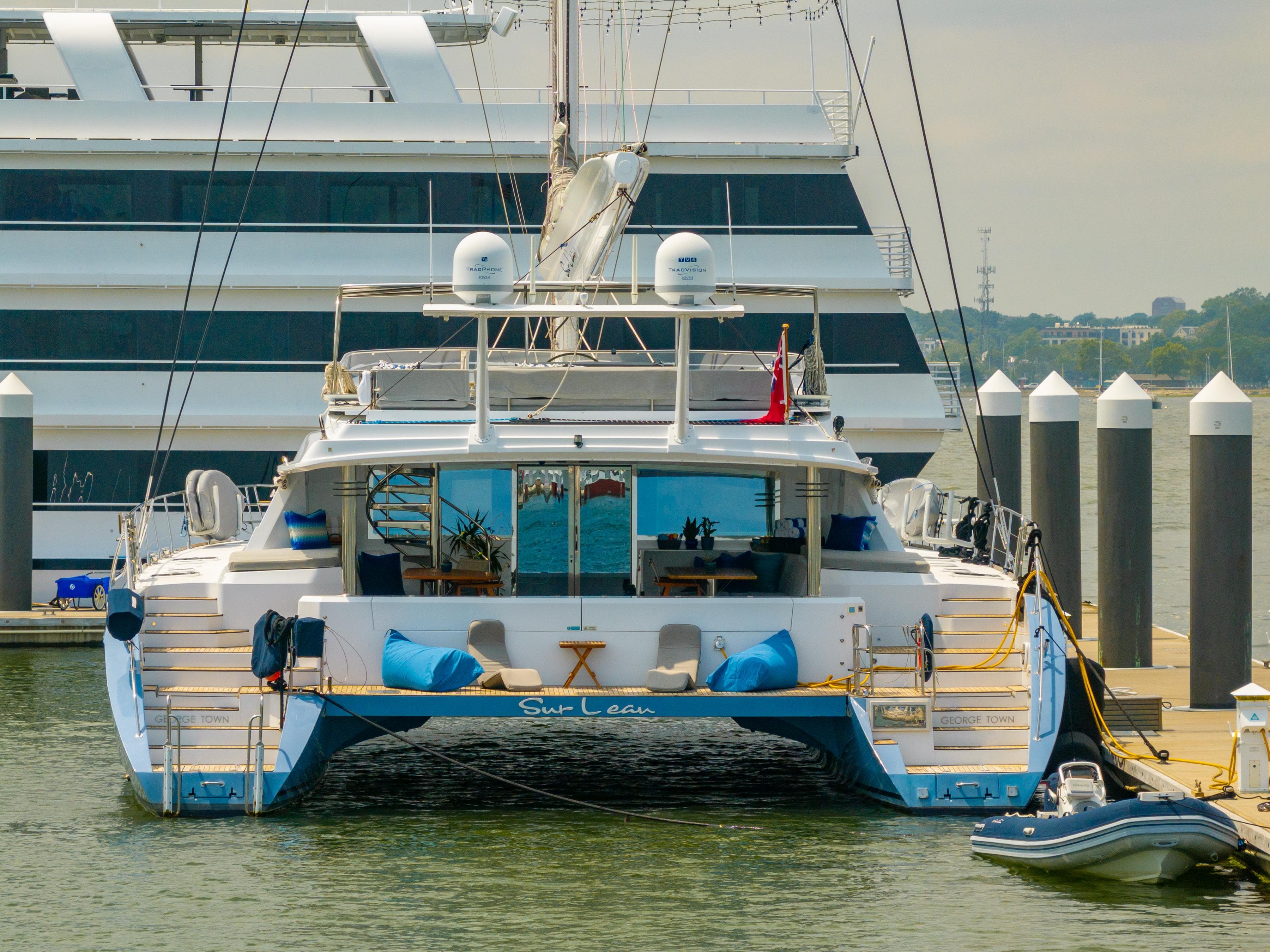 Luxury Privilege 745 yacht docked at marina, 2008 model, with modern amenities and sleek design.