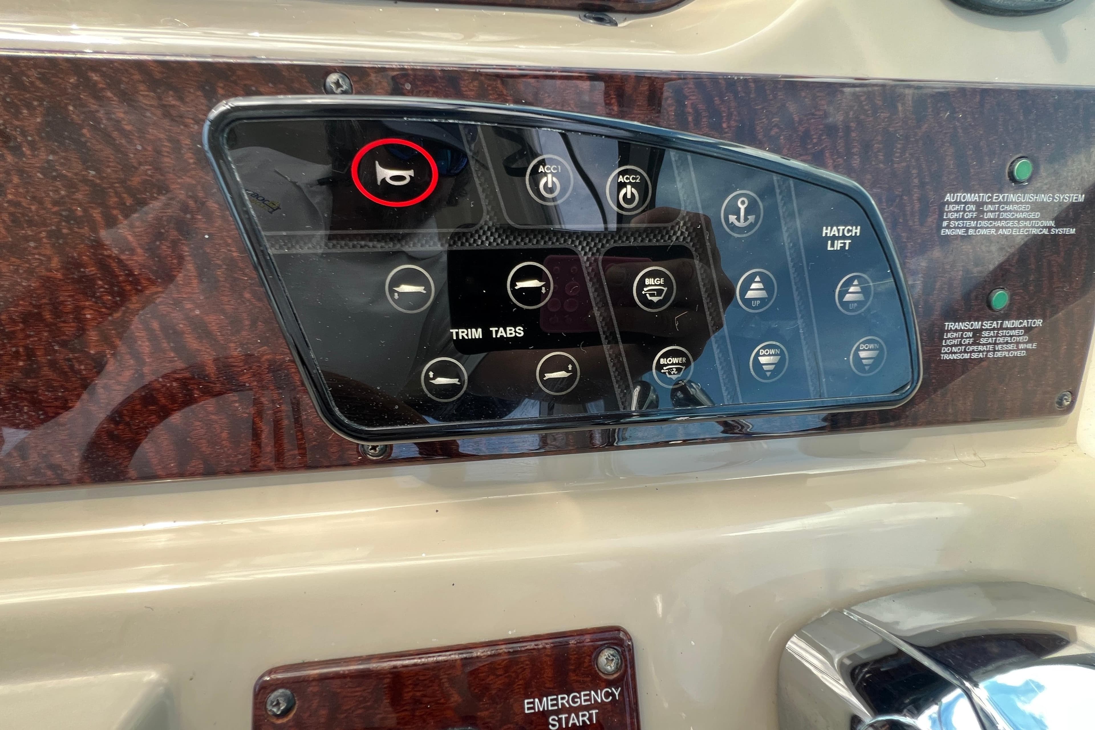 Control panel of a 2005 Sea Ray Sundancer 350 boat with various switches and indicators.