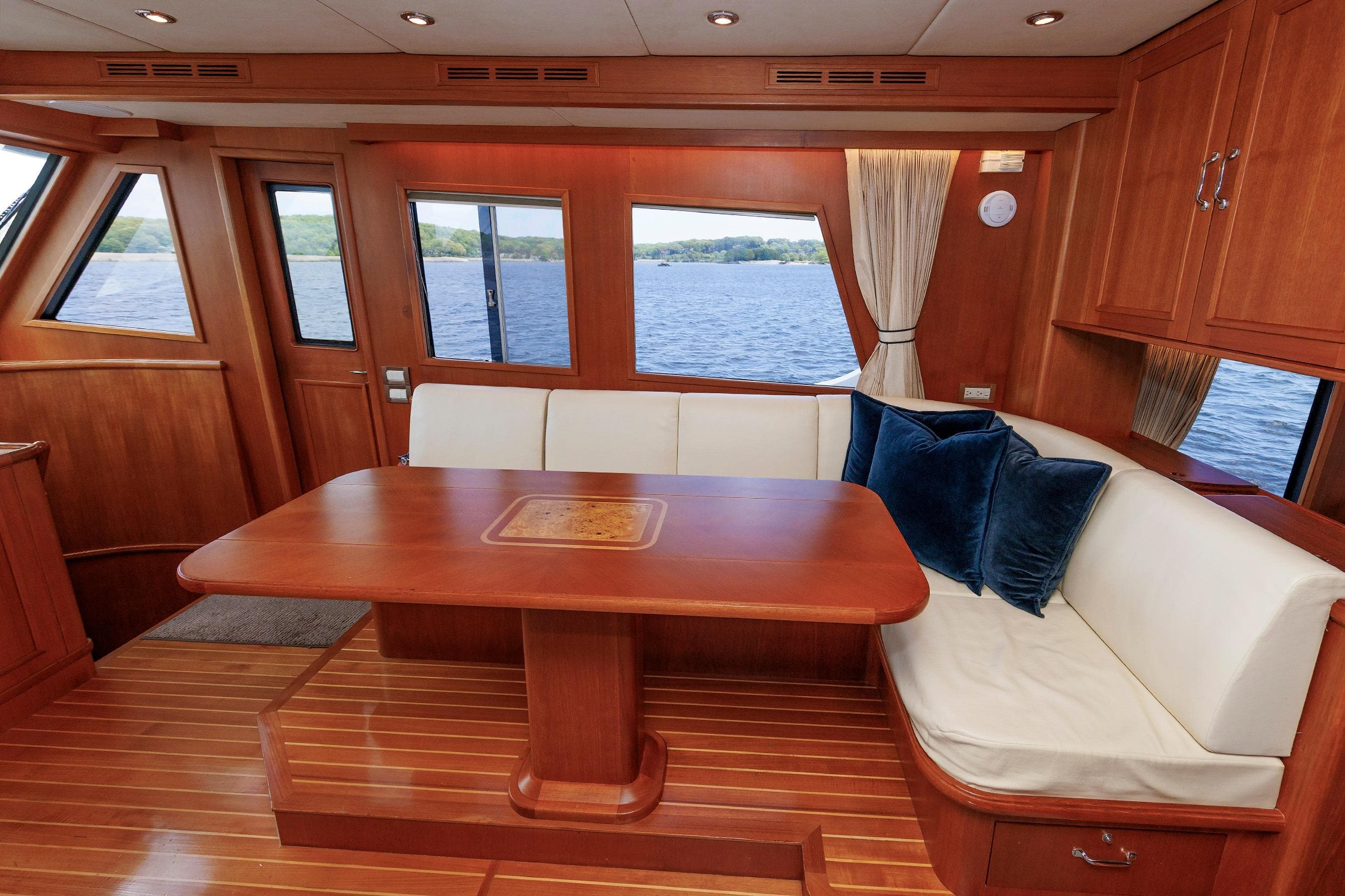 Luxurious interior of 2007 Grand Banks 59 Aleutian RP yacht with elegant wood finishes.