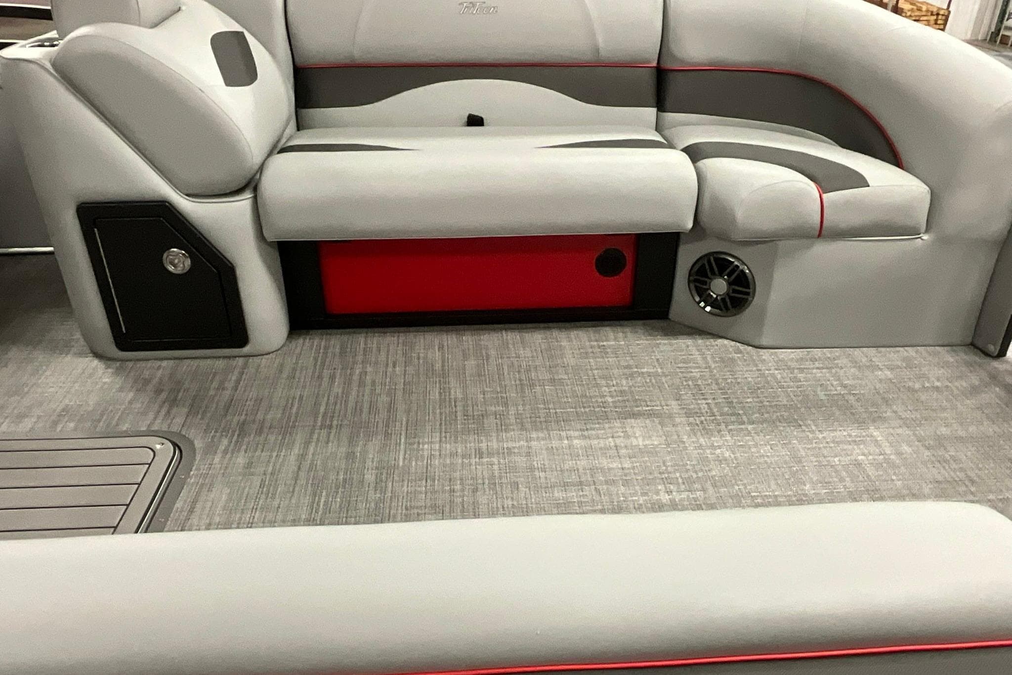 2026 JC NEPTOON SPORT 21TT boat interior with gray seating and red accents.