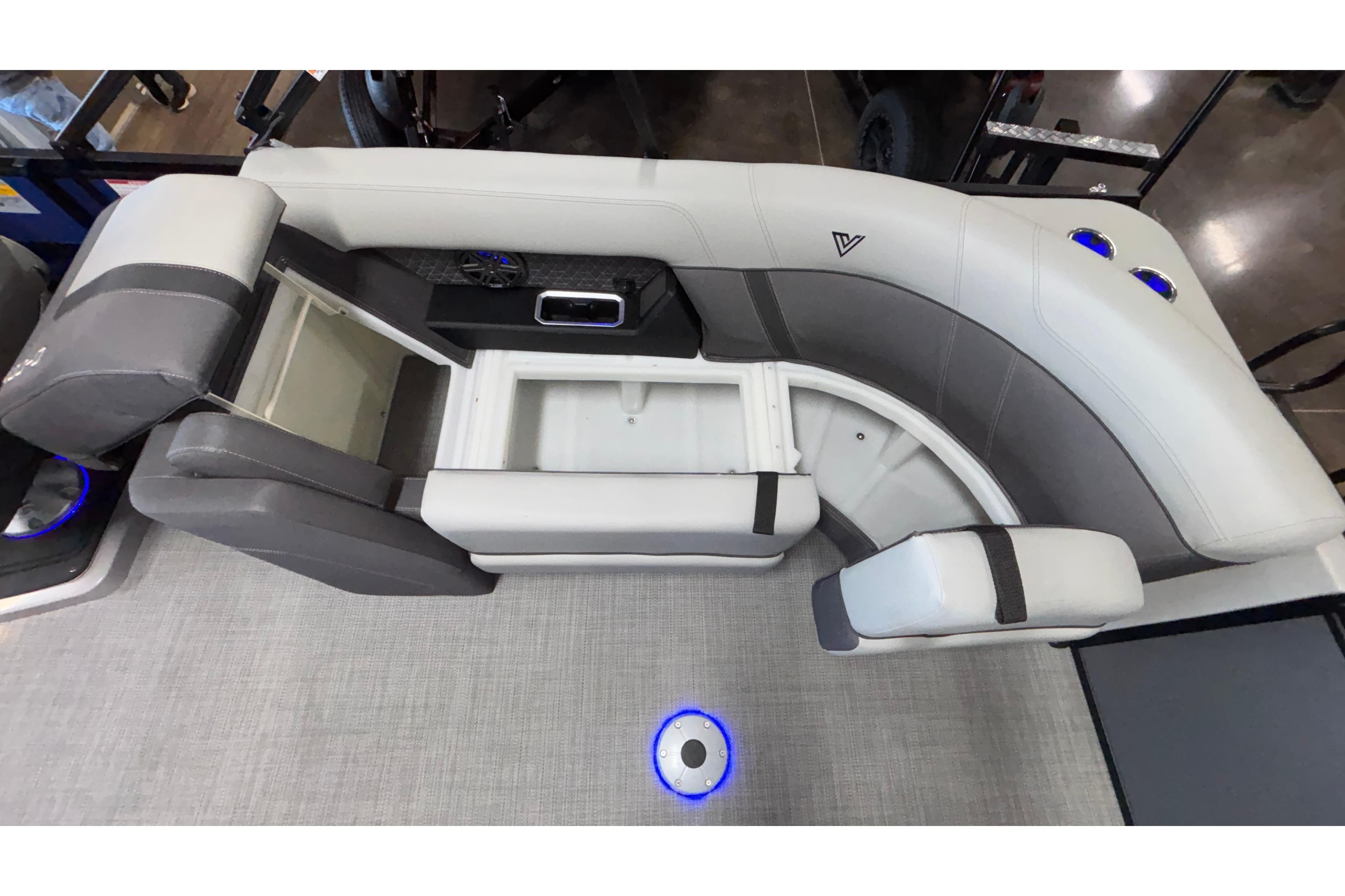 Interior of 2026 Viaggio Z24U boat with gray seating and storage compartments.