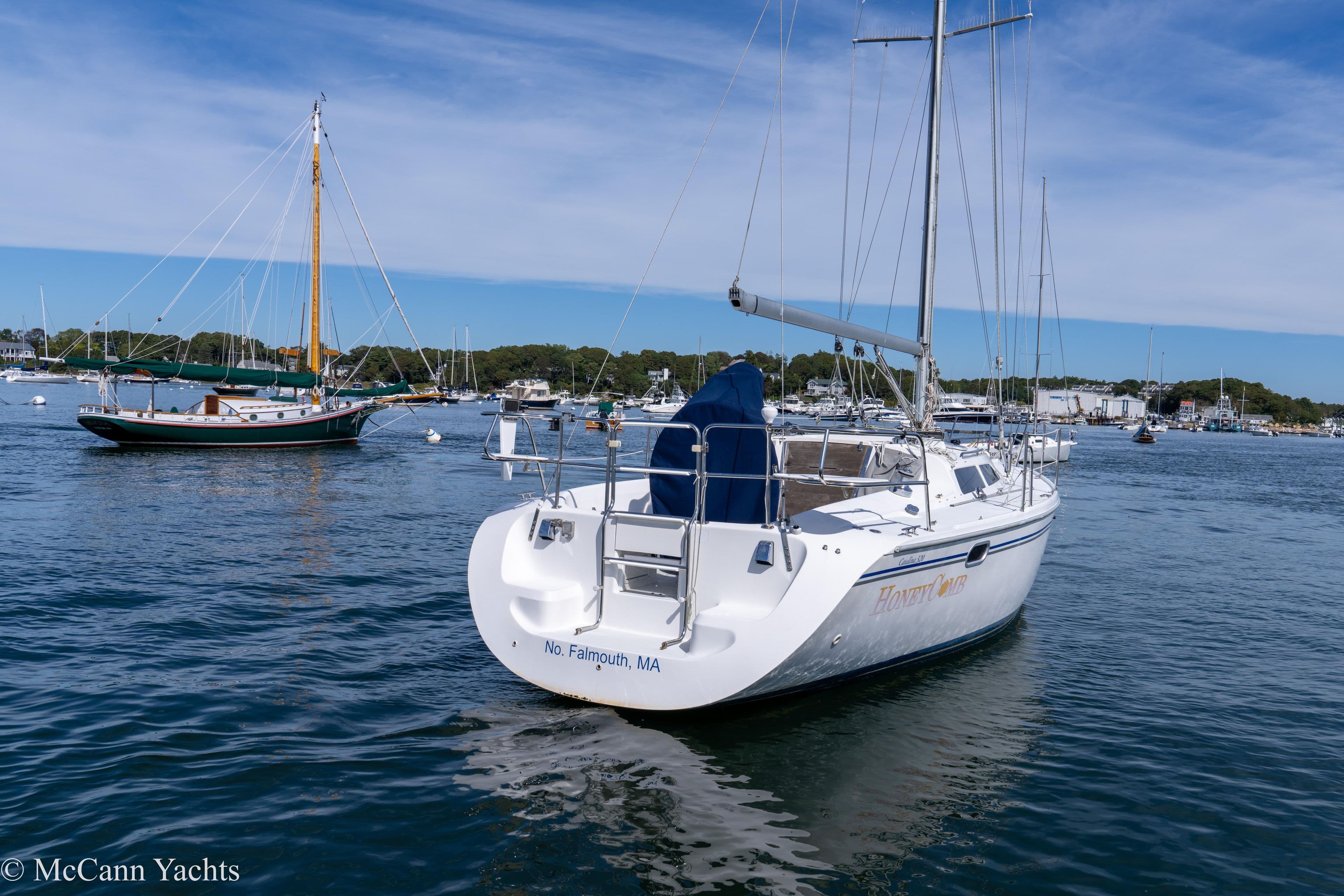 2003 Catalina 320 sailboat anchored in a scenic harbor, Falmouth, MA.