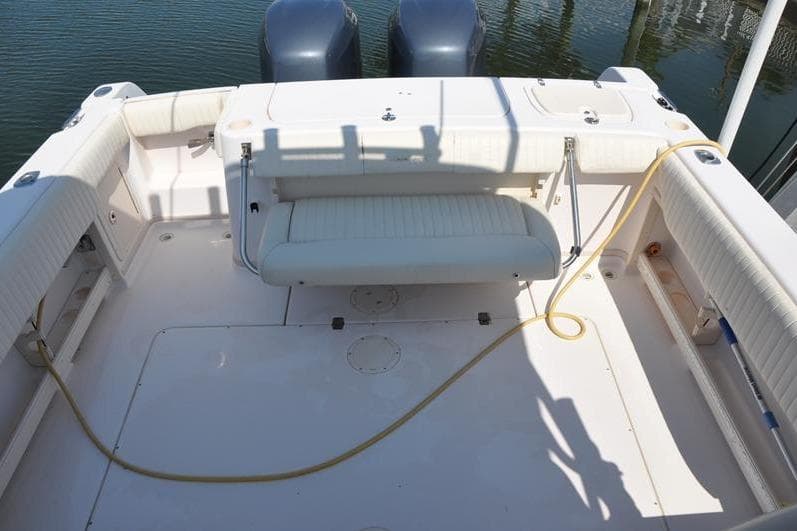 2010 Grady-White Chesapeake 290 boat deck with seating and twin engines.