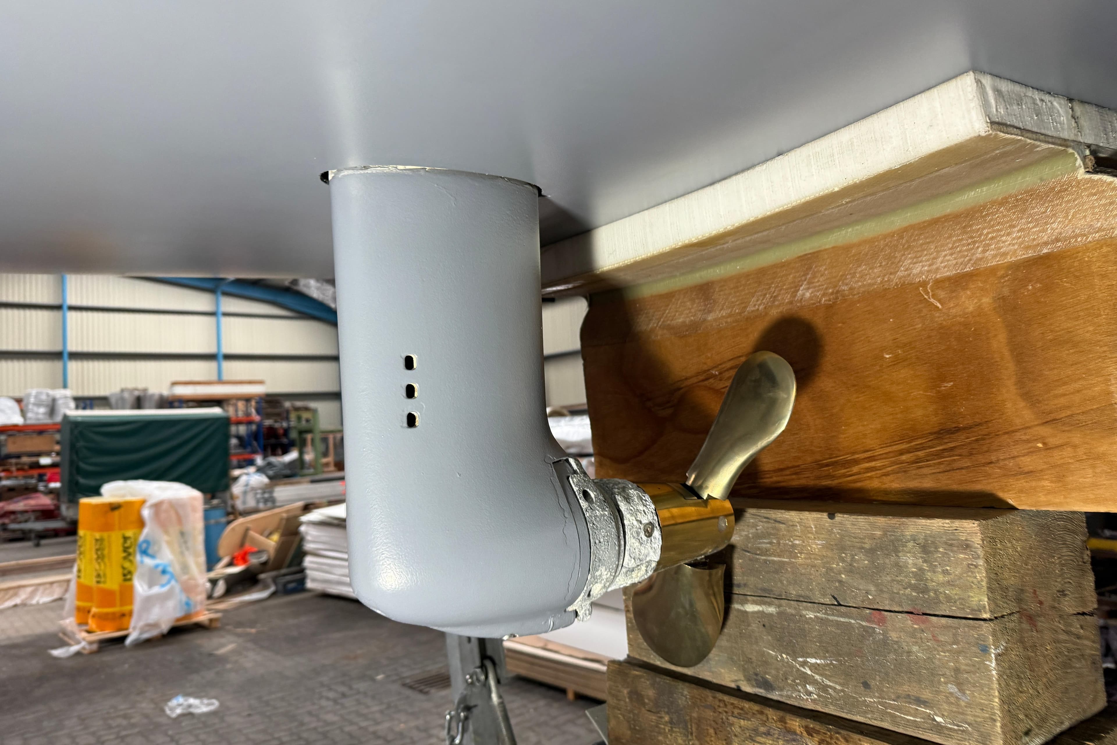 JPK 1030 sailboat propeller and rudder assembly in a workshop, 2019 model.