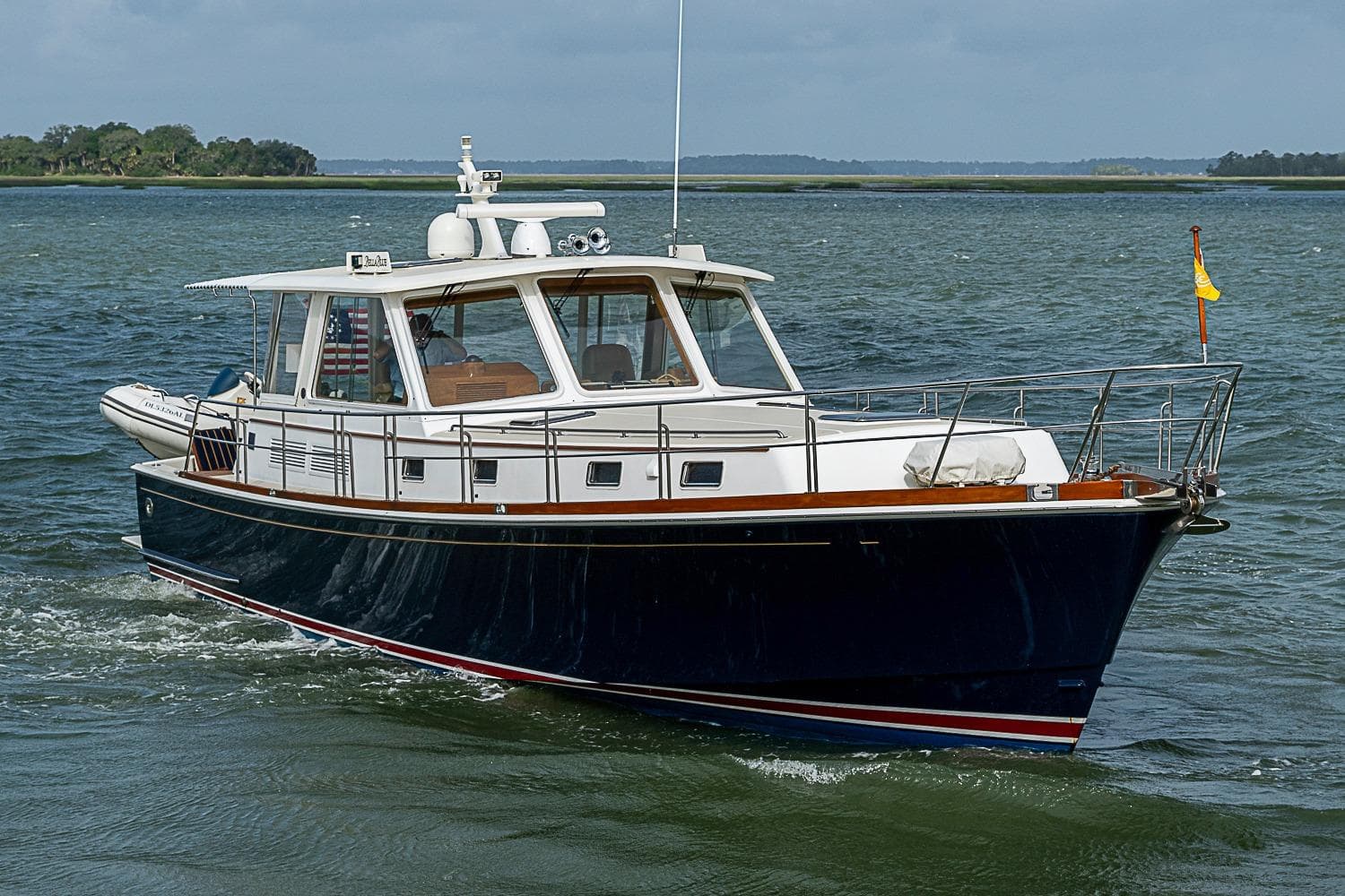 2004 Grand Banks 49 Eastbay HX yacht cruising on open water.