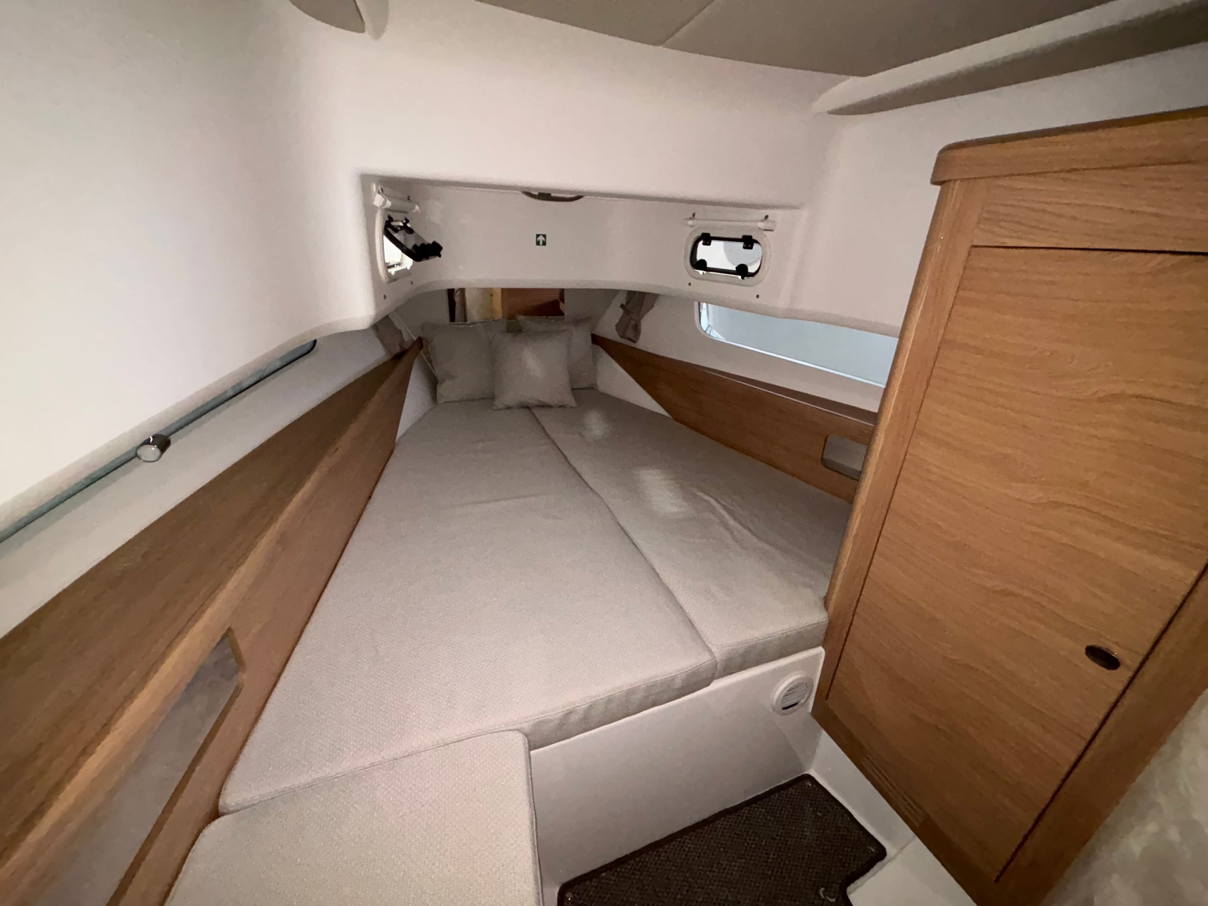 Cozy cabin interior of 2026 Nimbus Commuter 11 MKII Legacy Edition boat.