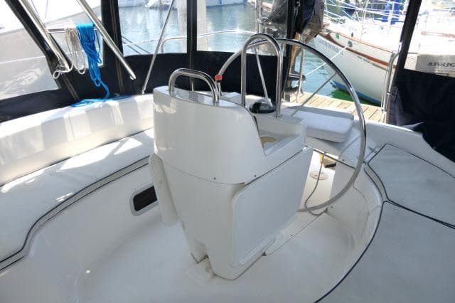 Cockpit of 2000 Hunter 460 sailboat with steering wheel and seating.