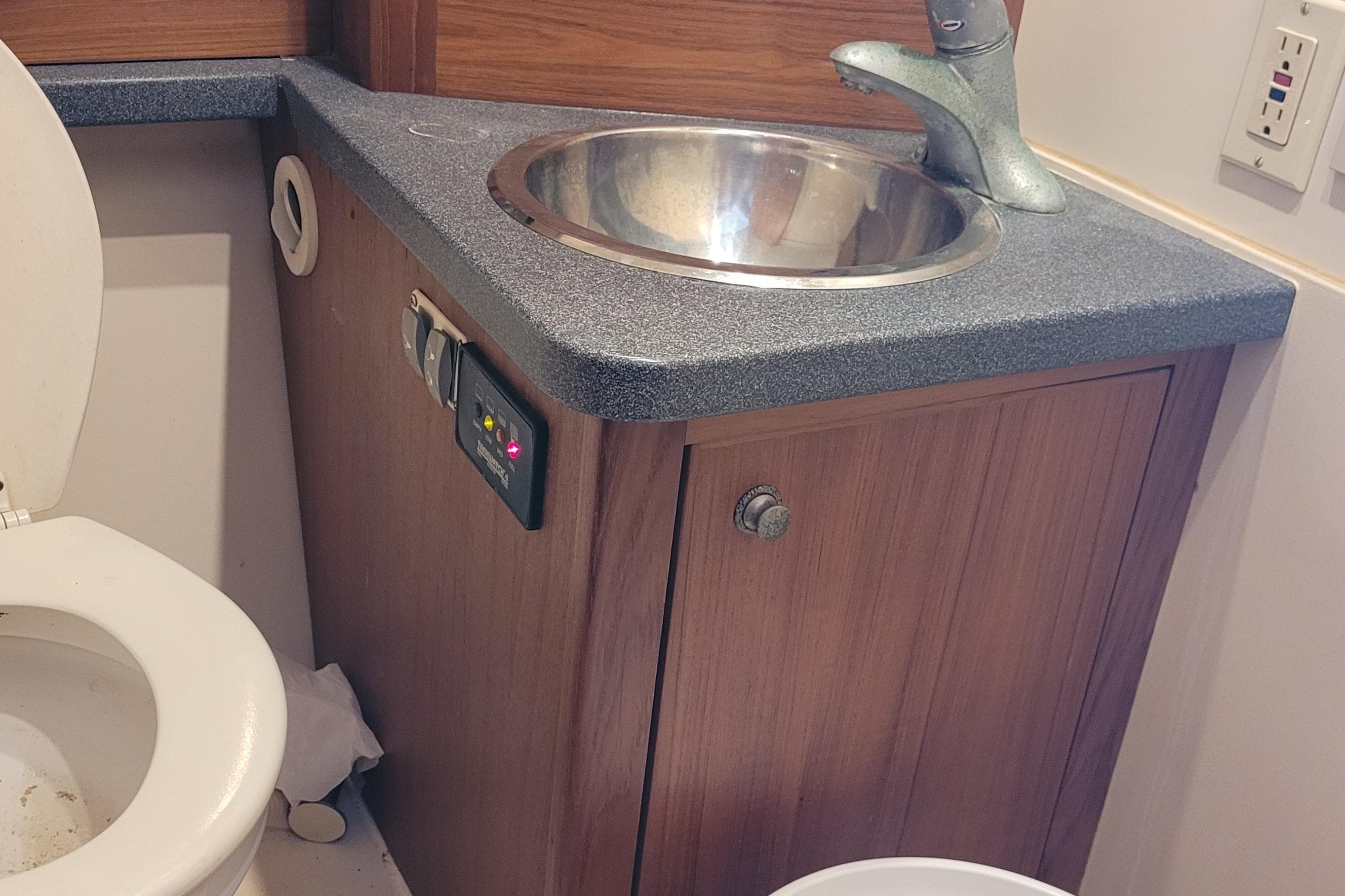 2001 Luhrs 34 Convertible bathroom with sink, faucet, and toilet.