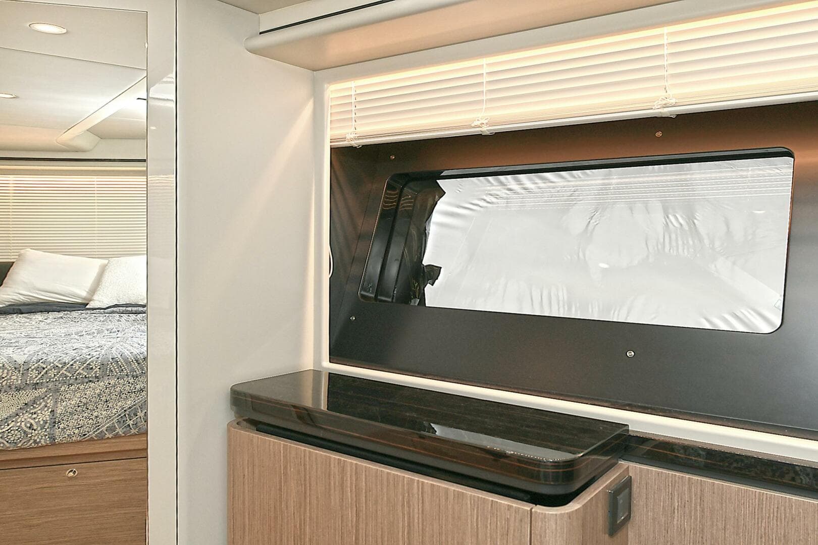 Interior of 2022 Absolute 62 Fly yacht with modern design and window view.