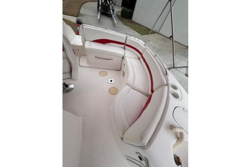 2000 Chaparral 232 Sunesta boat interior with white and red seating.