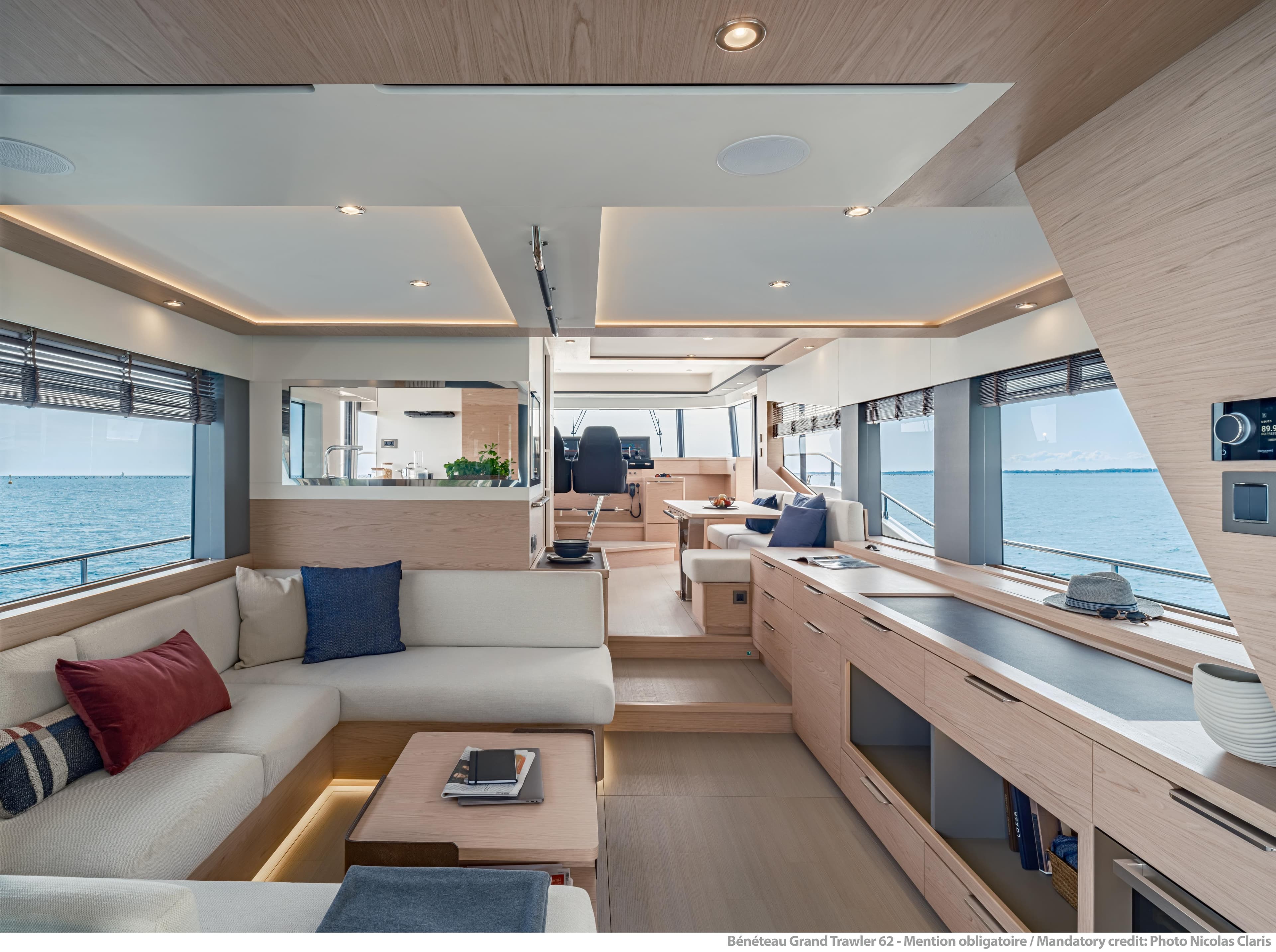 Luxurious interior of 2025 Beneteau Grand Trawler 62 yacht with modern design and ocean view.